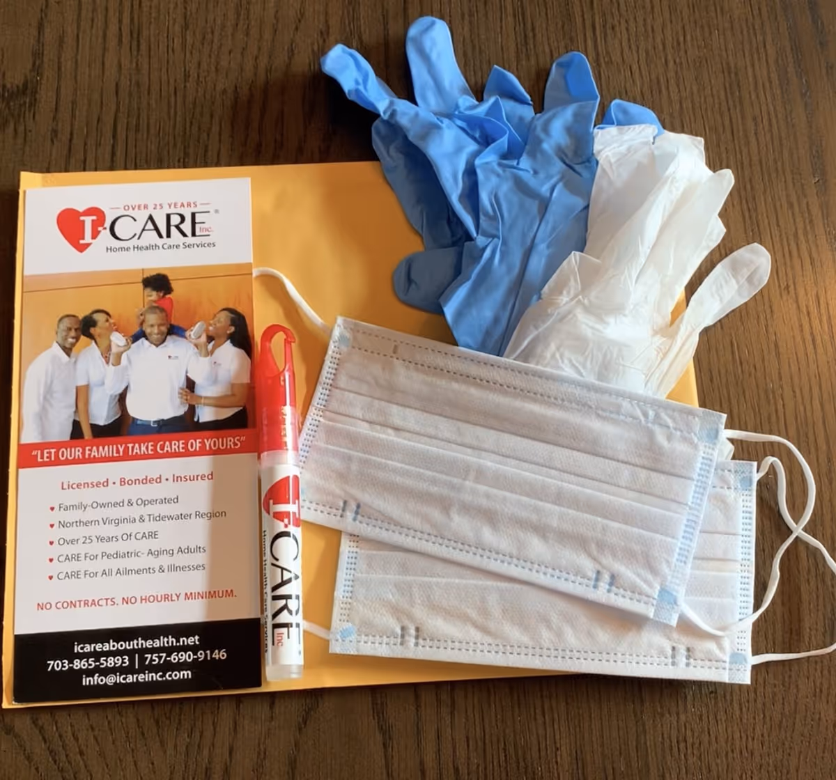 Blue and white gloves, face masks, and an I-CARE Home Health Care brochure on a table.
