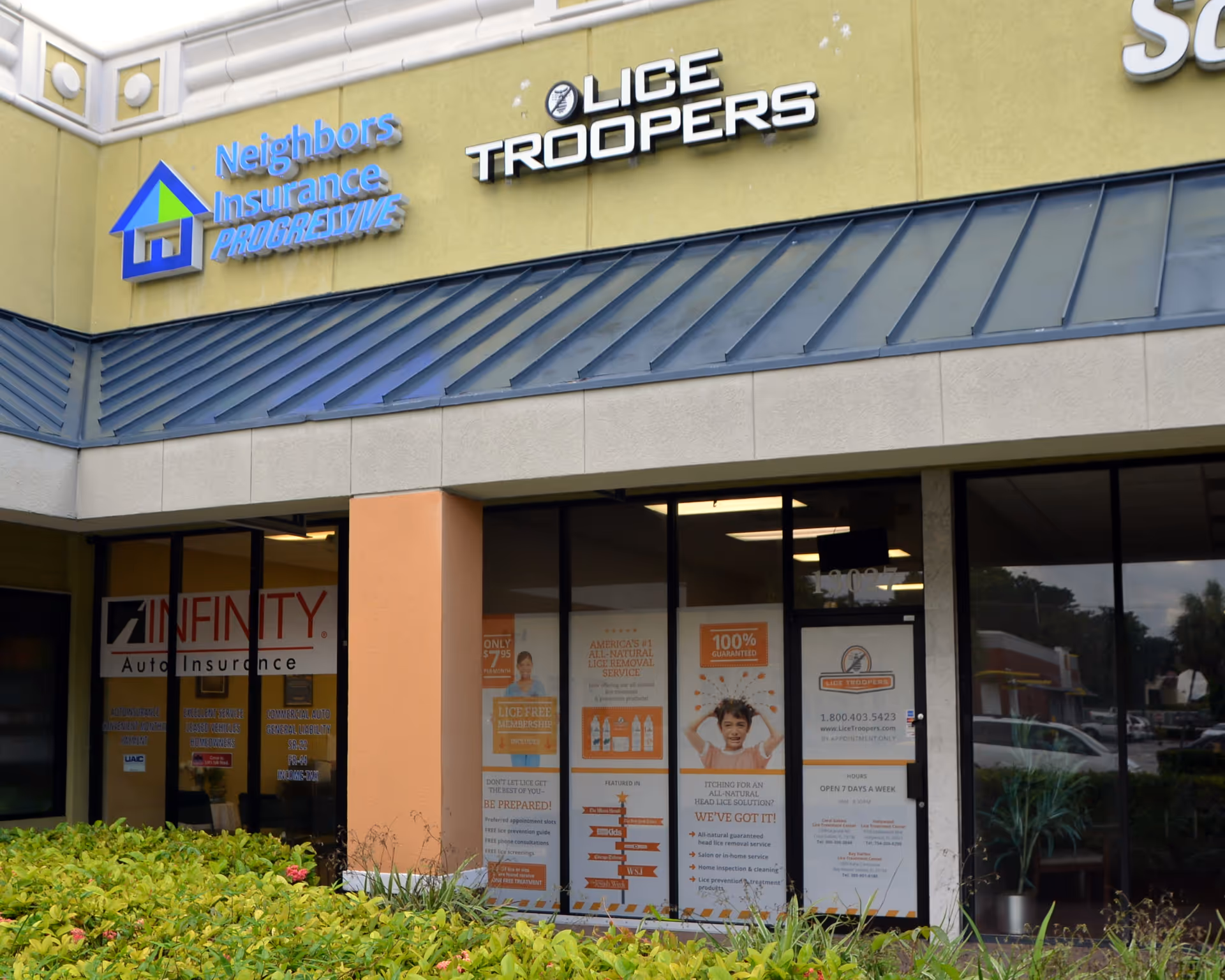 Exterior storefront of a strip mall with Lice Troopers clinic signage and adjacent tenants.