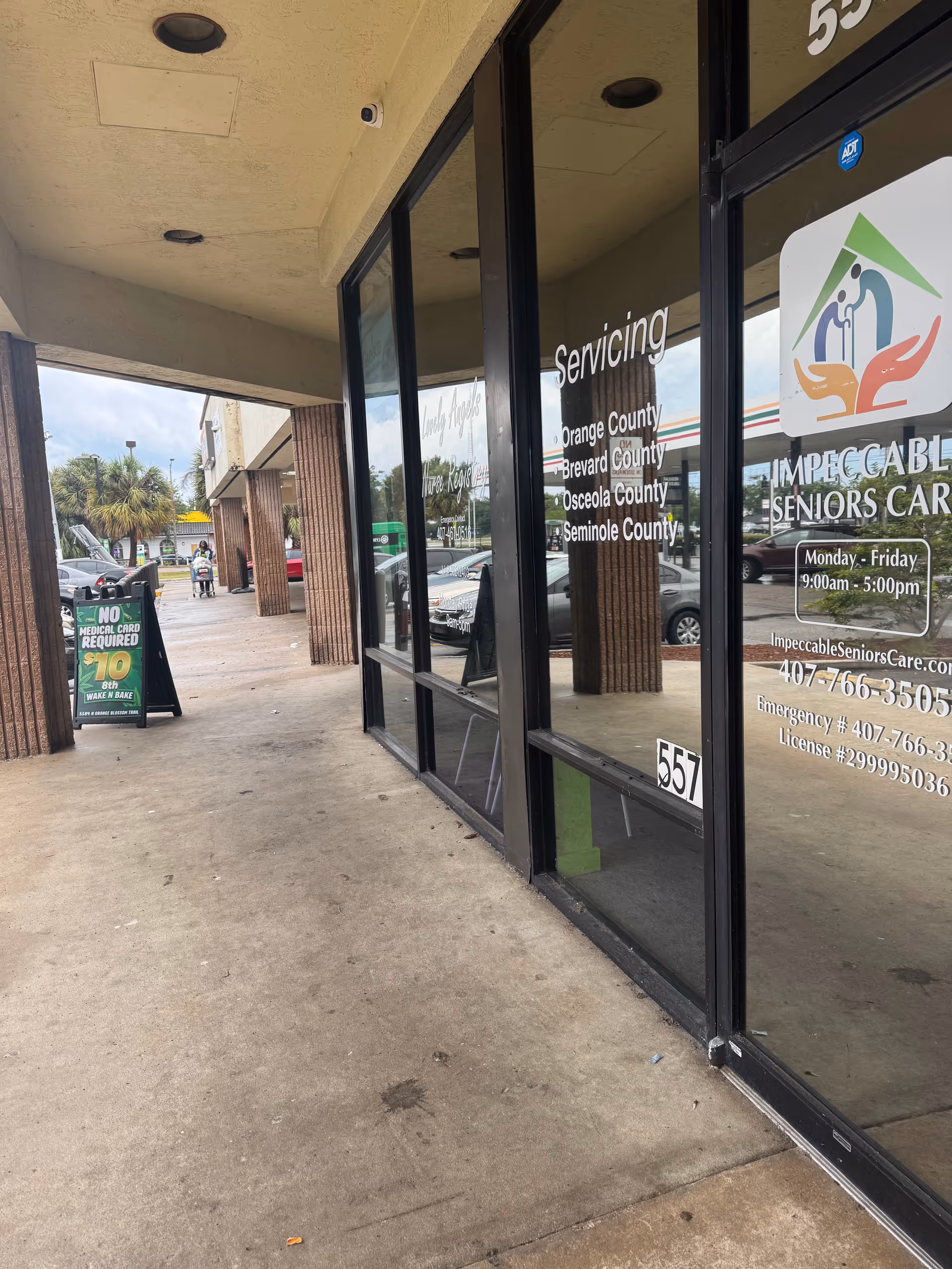 Exterior view of Impeccable Seniors Care storefront with glass doors and signage.