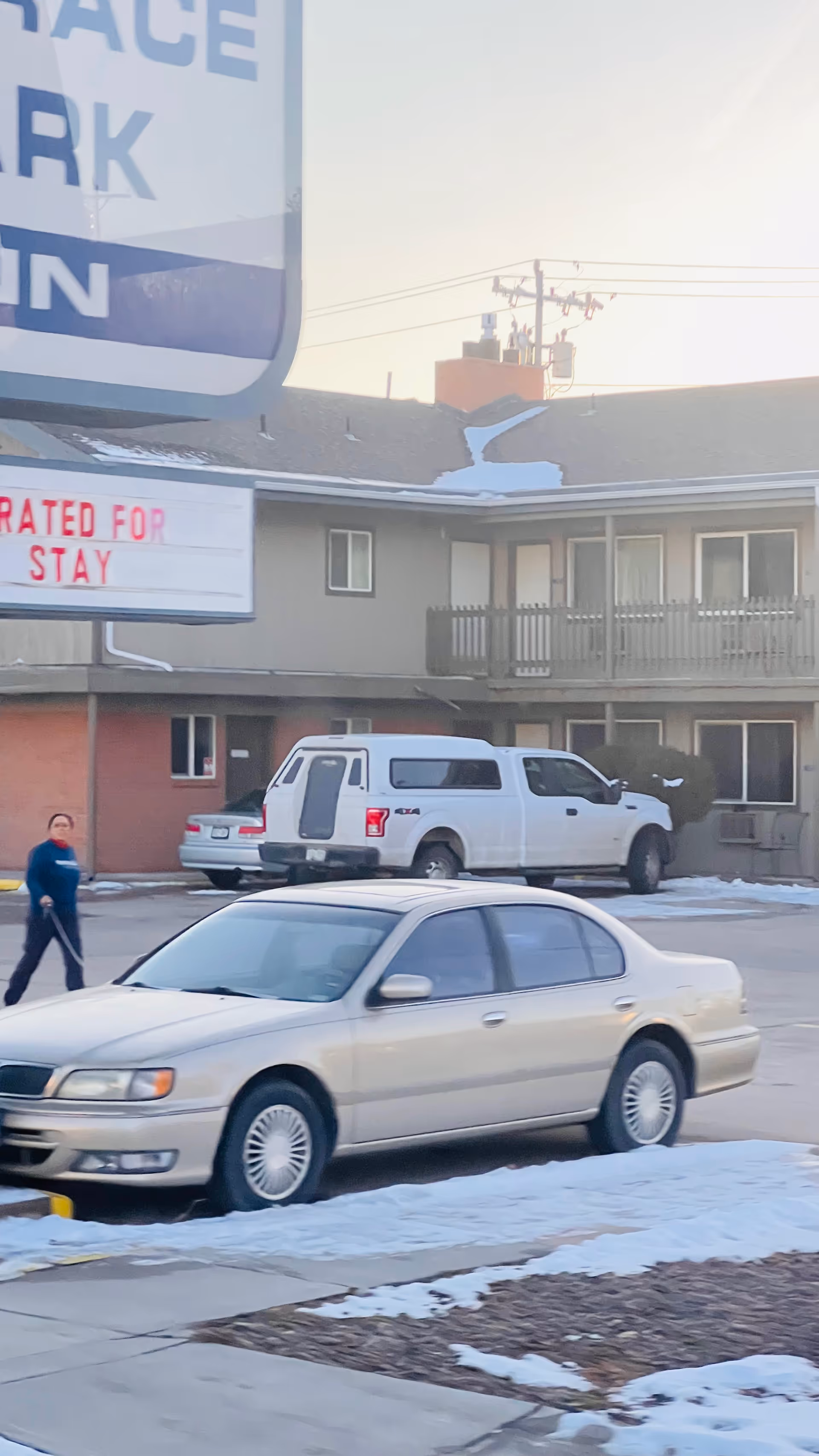 Exterior view of Colorado Plains Medical Center Home Care building with nearby vehicles.