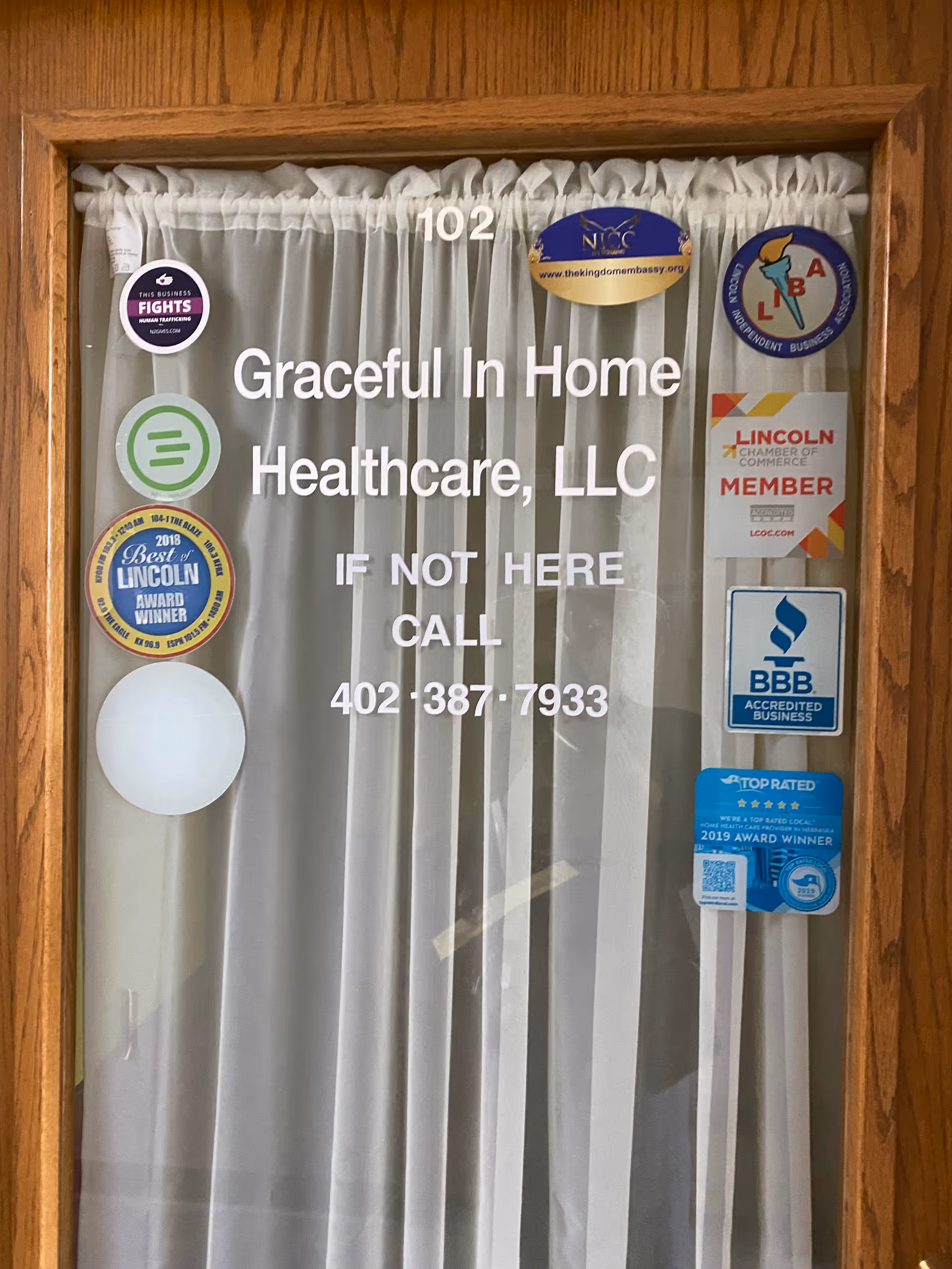 Graceful In Home Healthcare signage on front door with accreditation stickers