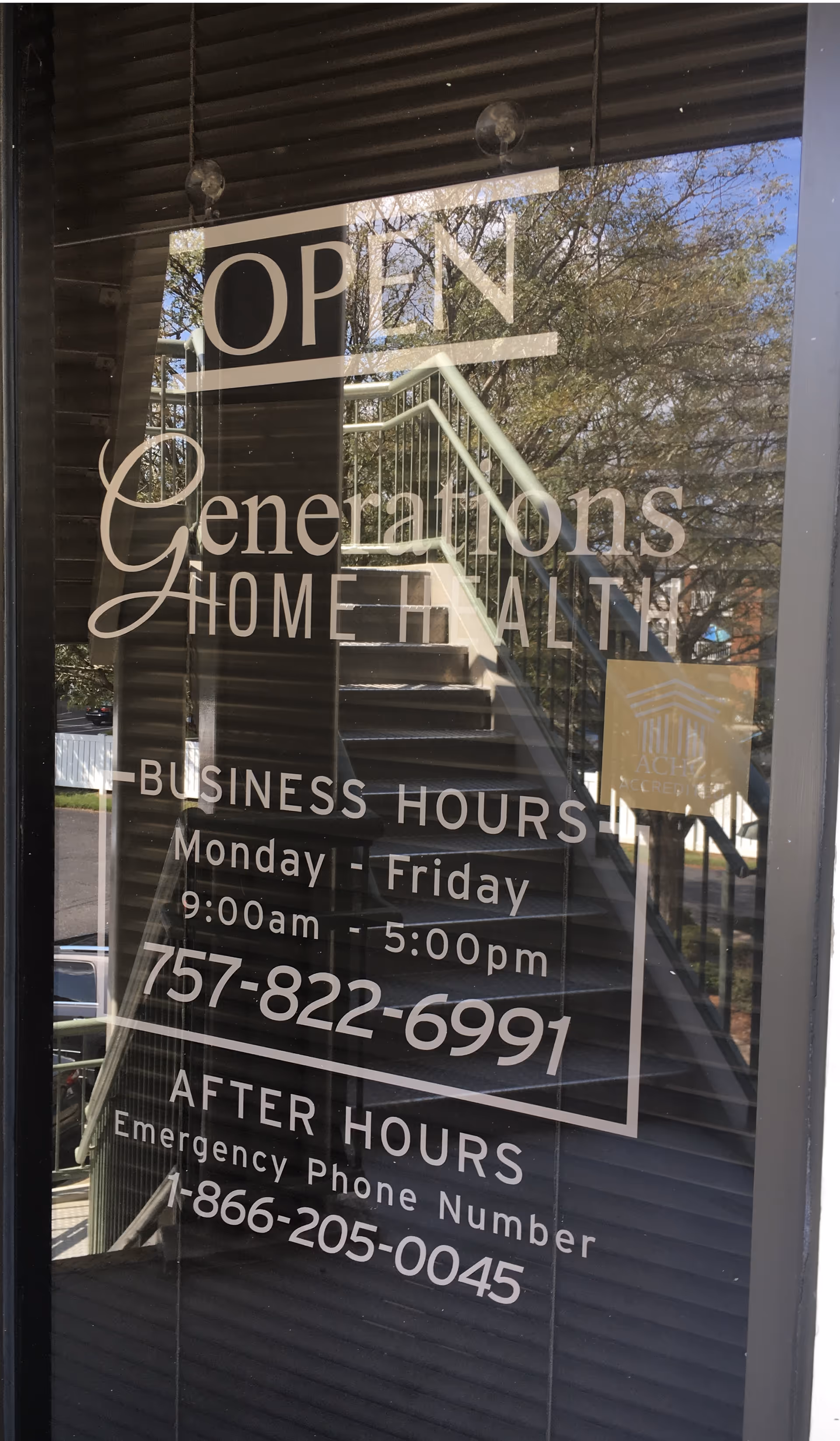 Glass door shows OPEN sign and Generations Home Health signage, stairs visible inside.