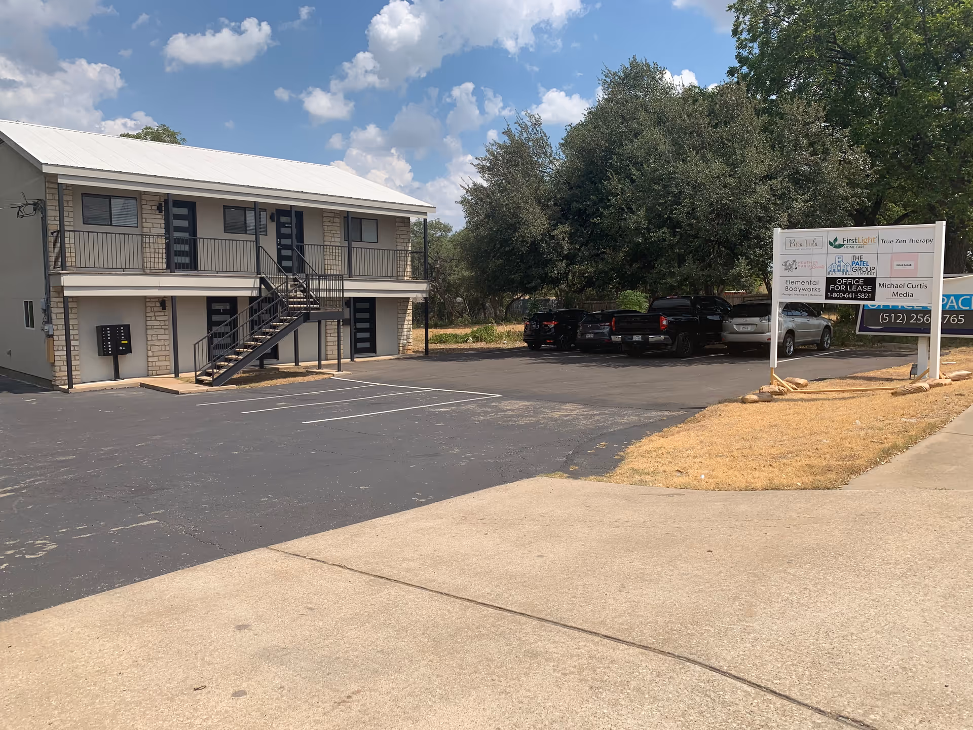 Exterior view of FirstLight Home Care of North Austin building with a parking lot.
