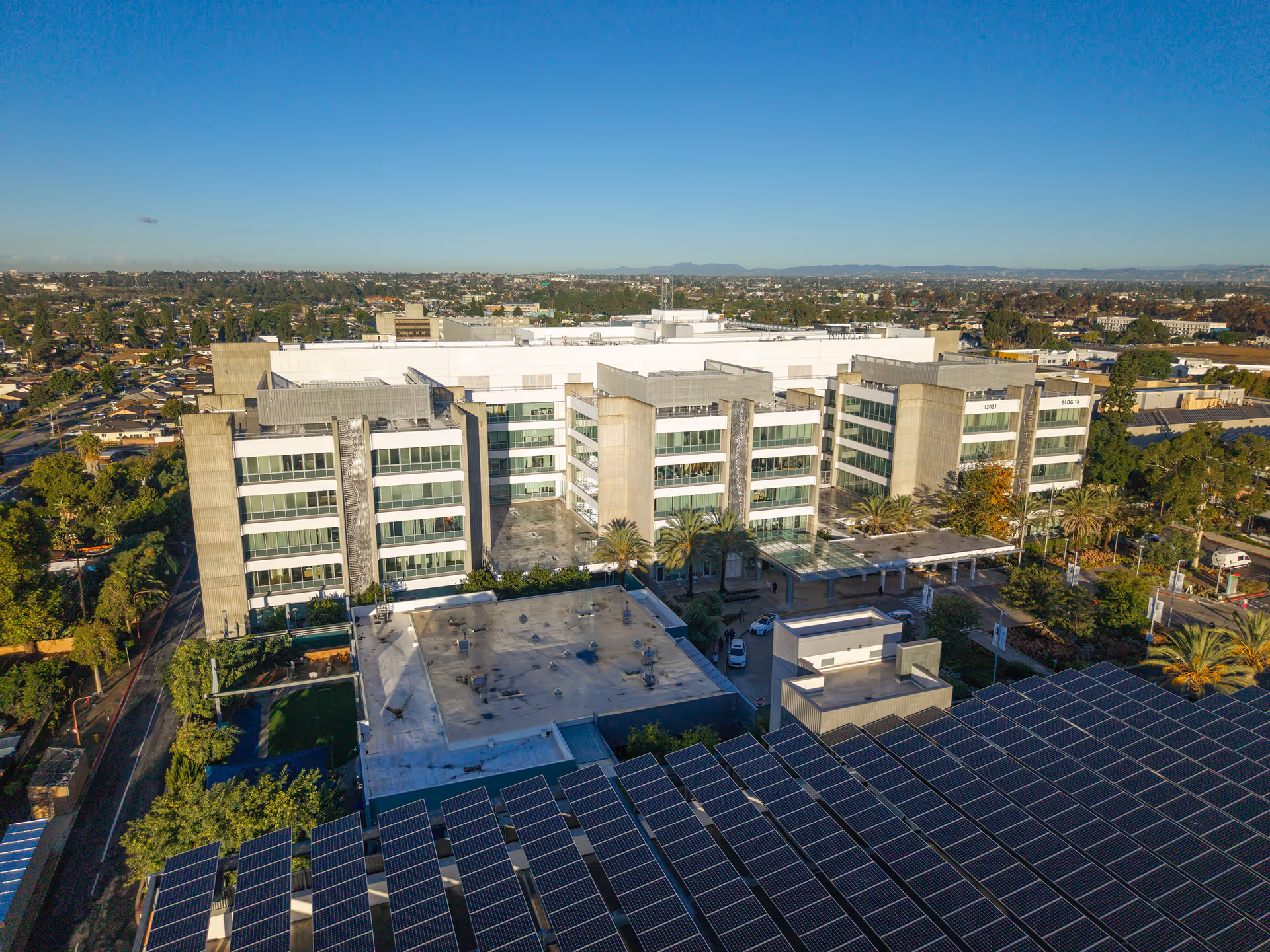 Aerial view of Los Angeles Care Center, a modern senior facility with solar panels.