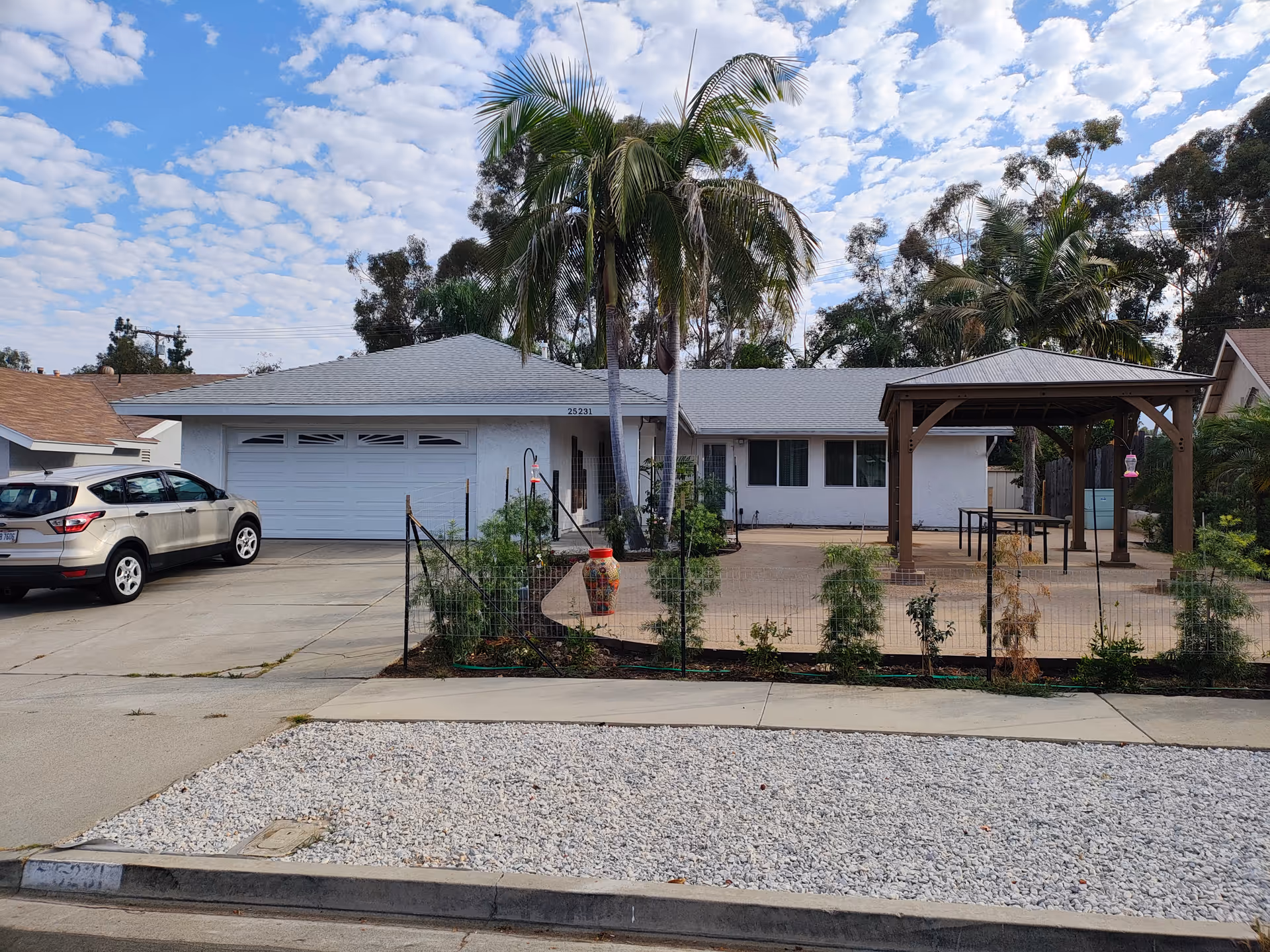 Front exterior of Golden Hearts Elderly Care 2, a single-story facility with driveway and pergola.