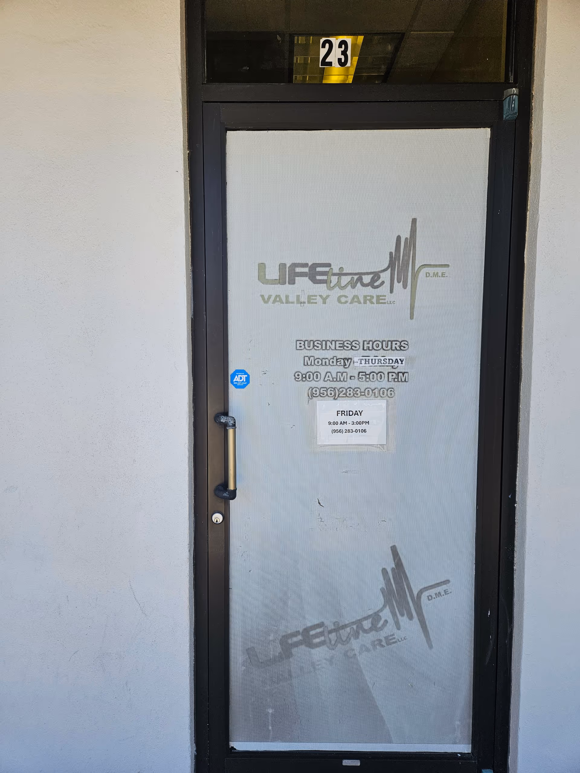 Front door entrance with Lifeline Valley Care logo and business hours on glass panel.