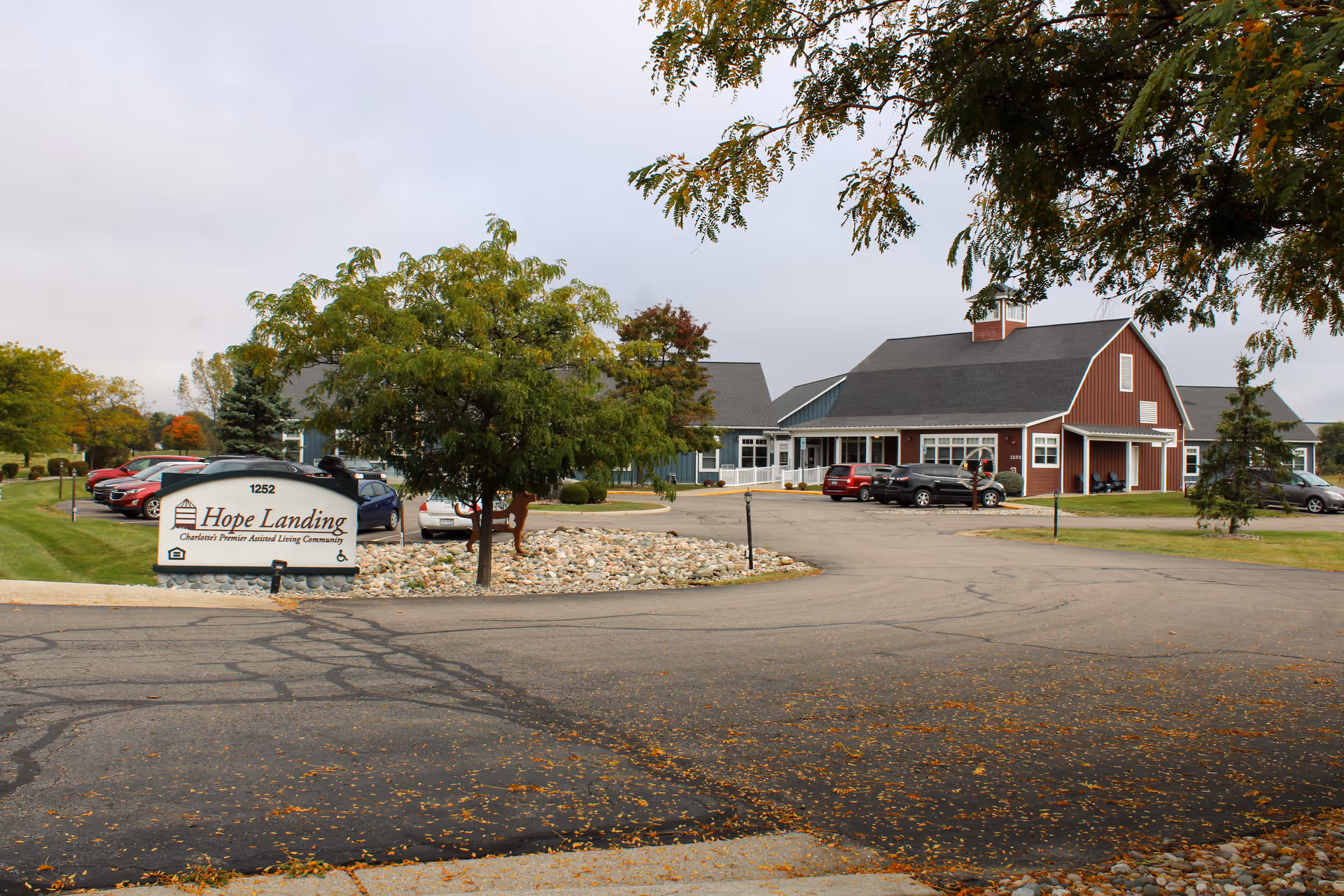 Exterior view of Hope Landing senior living facility with sign and parking