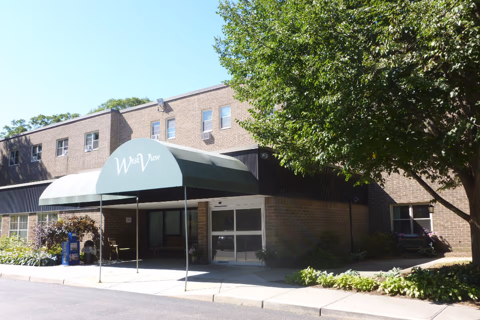 West View Nursing and Rehabilitation Center exterior with green curved awning at entrance.