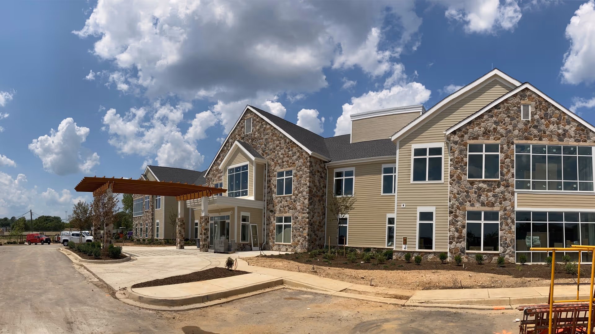 Front view of Gilchrist Center Baltimore, a large senior living facility with stone facade.