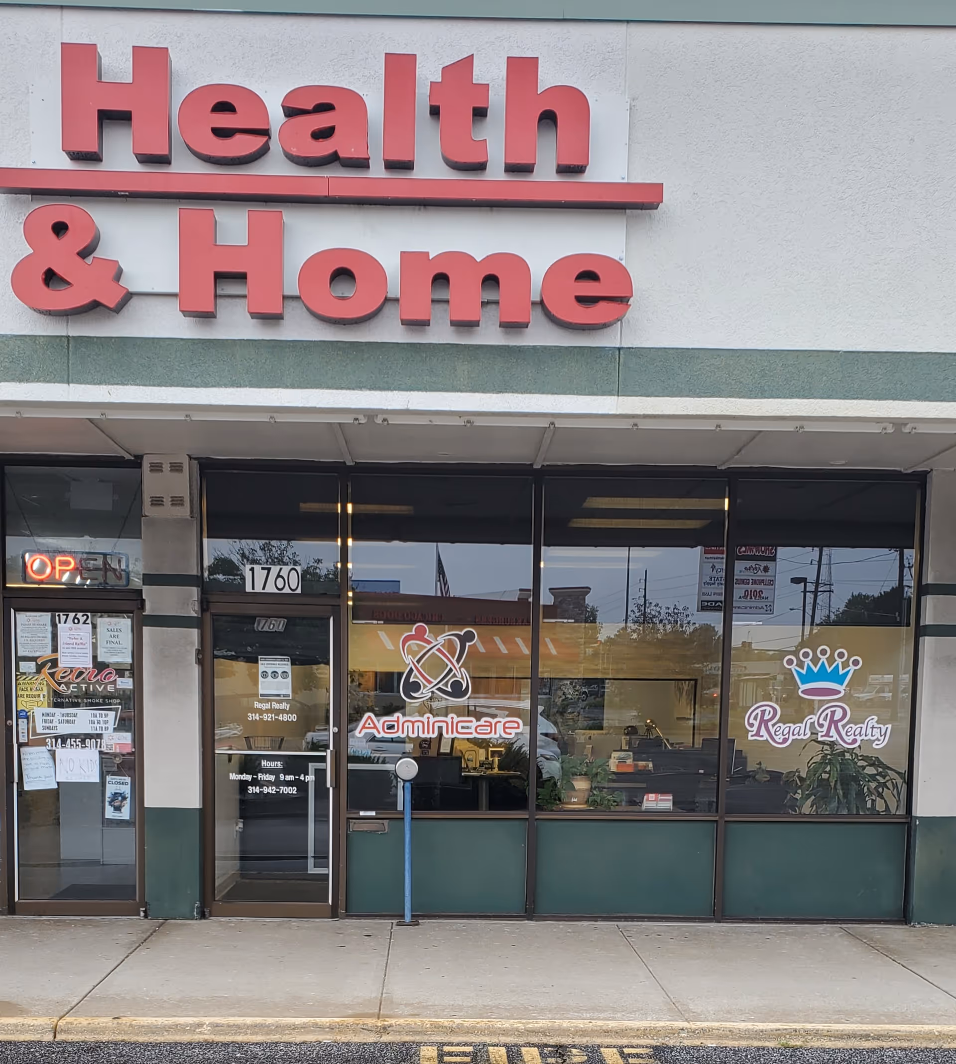 Storefront with Health & Home sign and Adminicare logo on glass storefront windows.