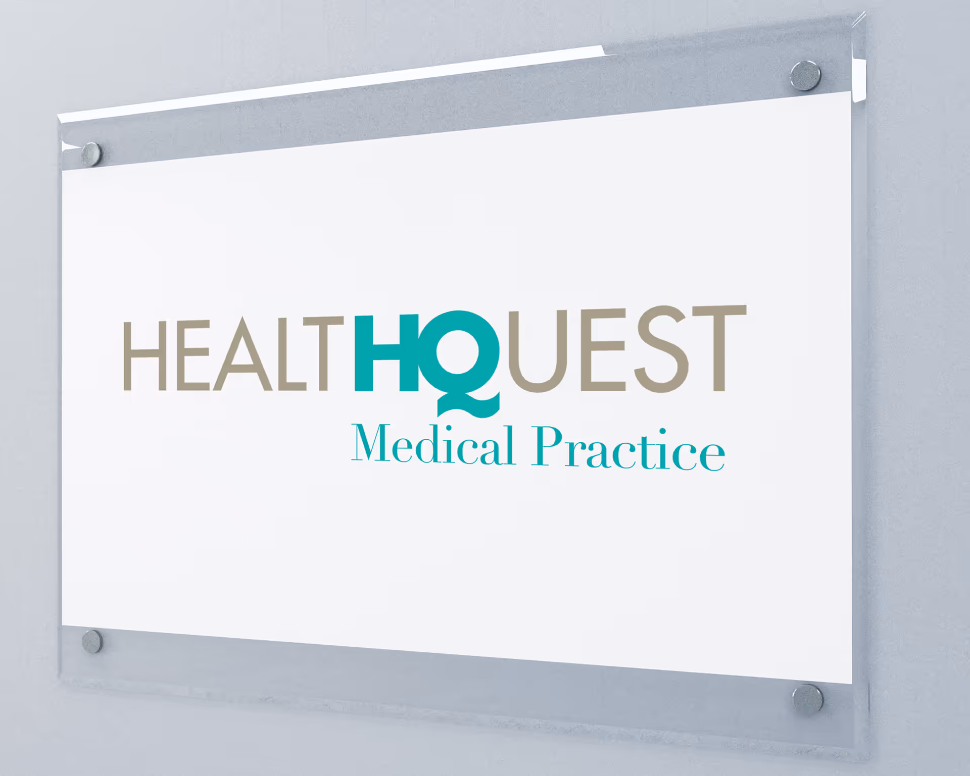 Signage reading HEALTHQUEST Medical Practice mounted on a light wall.