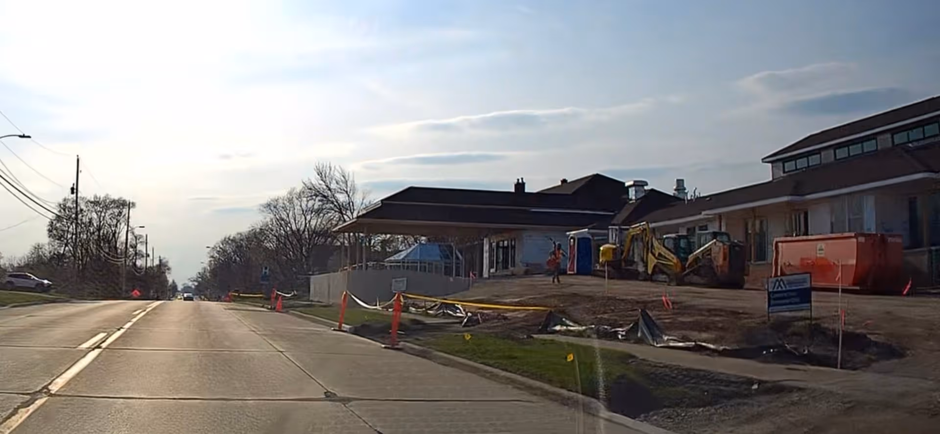 Exterior view of Brown Wilcox Retirement Home under construction along a street.