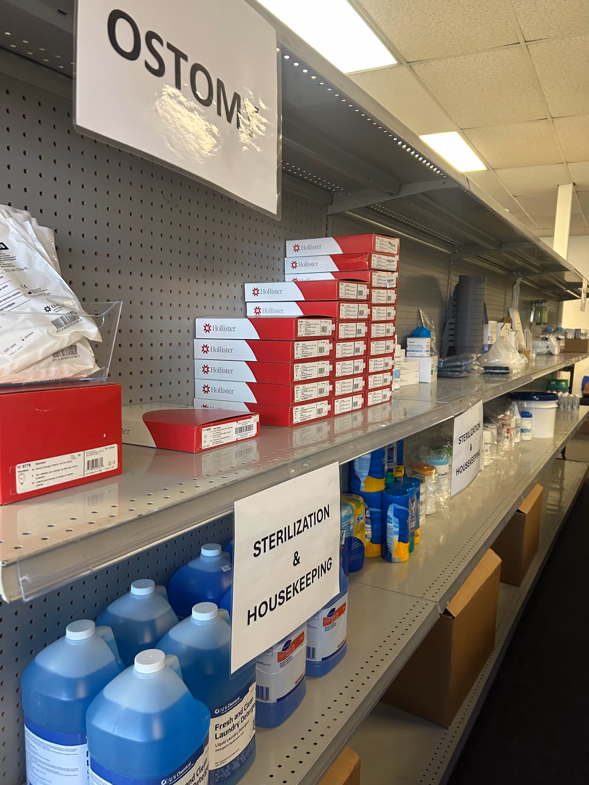 Interior aisle with ostomy supplies, cleaning products, and sterilization signage.