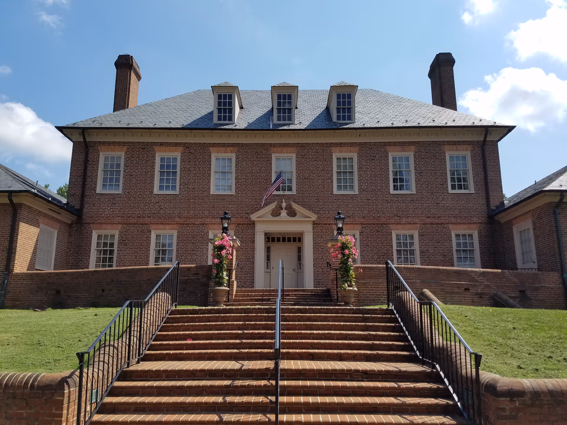 Exterior view of Petersburg Home for Ladies, a brick two-story building with steps and planters.
