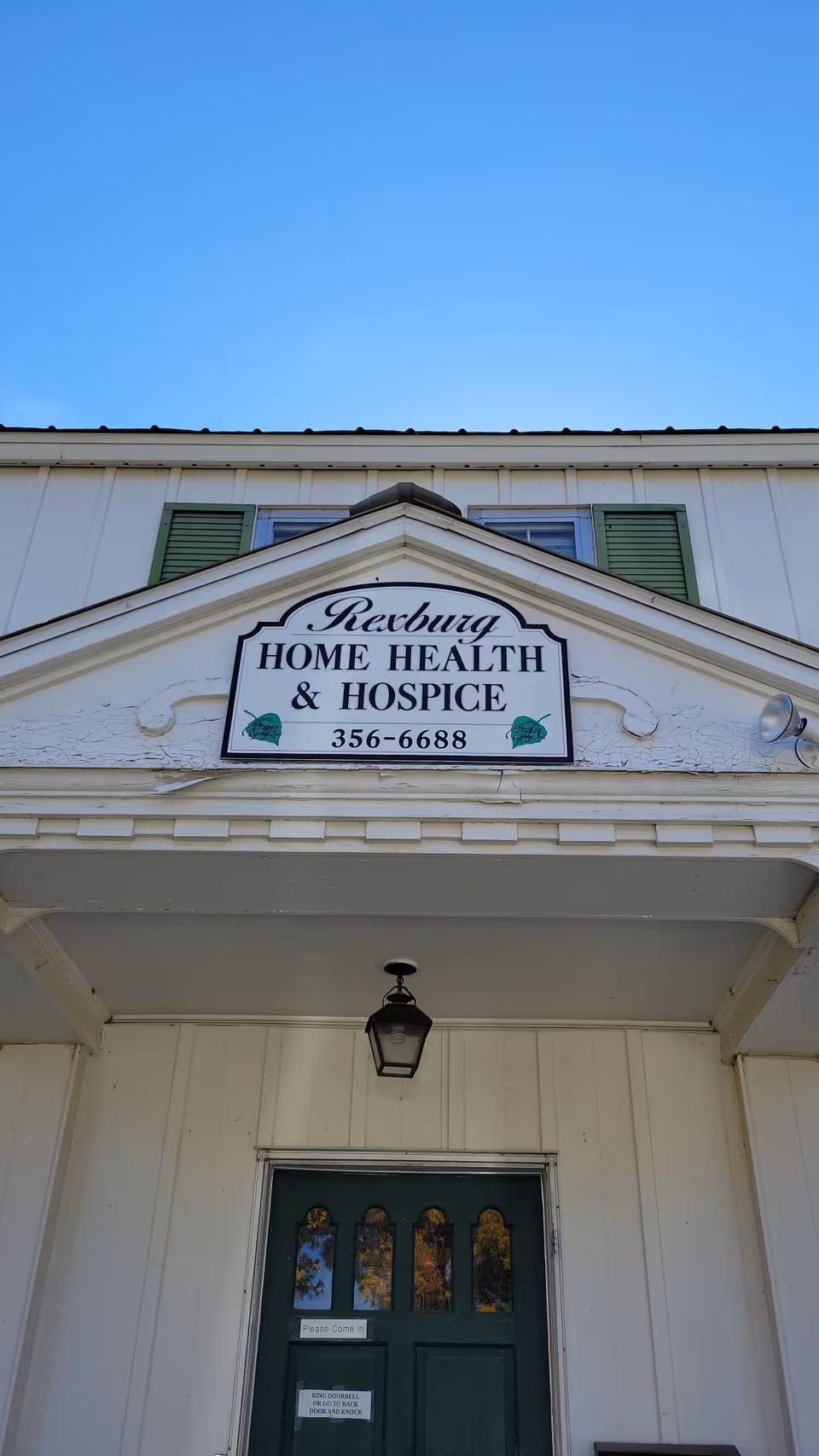 Front view of Rexburg Home Health & Hospice building entrance with sign.