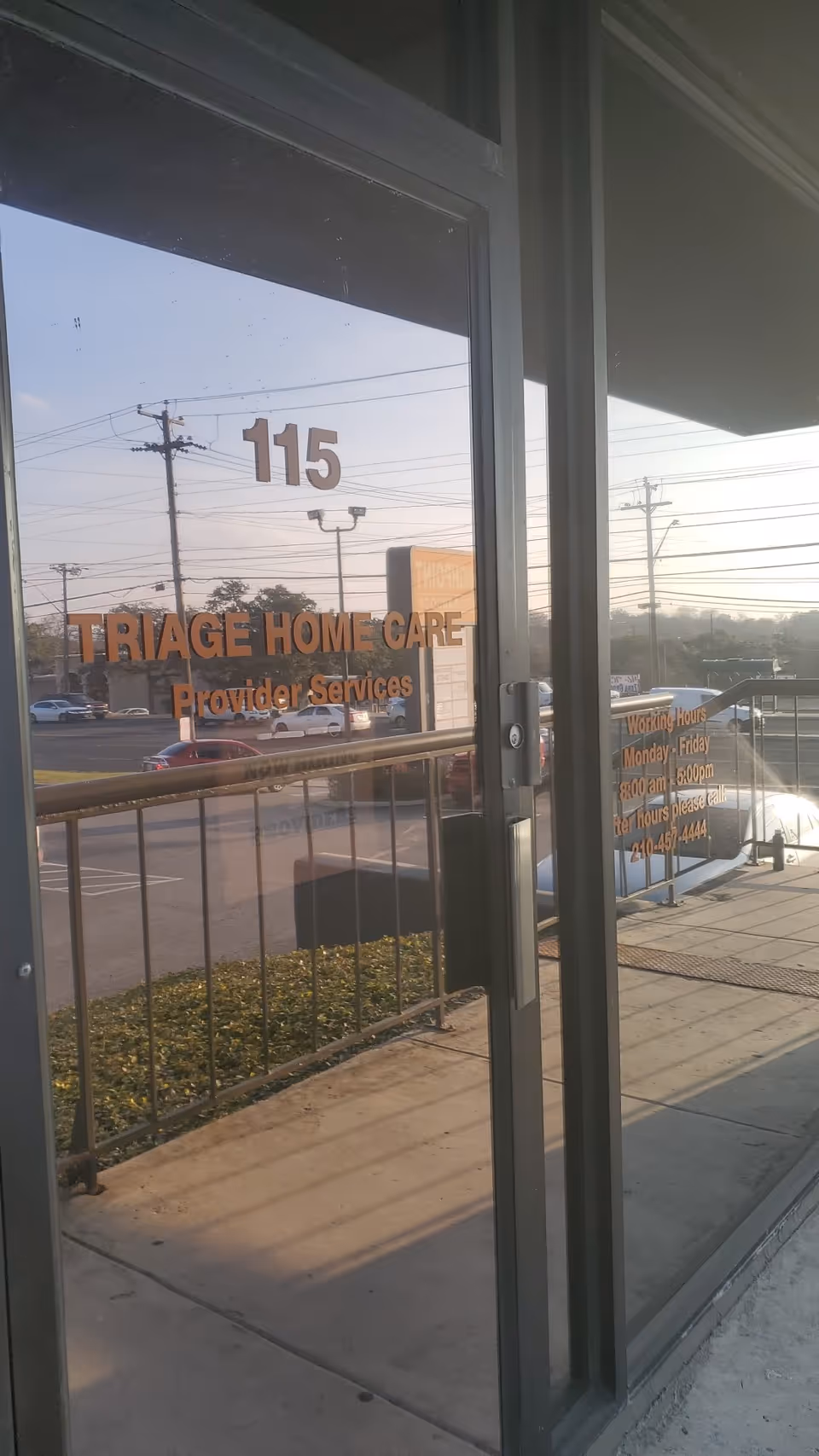 Glass entry door displays TRIAGE HOME CARE and Provider Services with a parking lot outside.