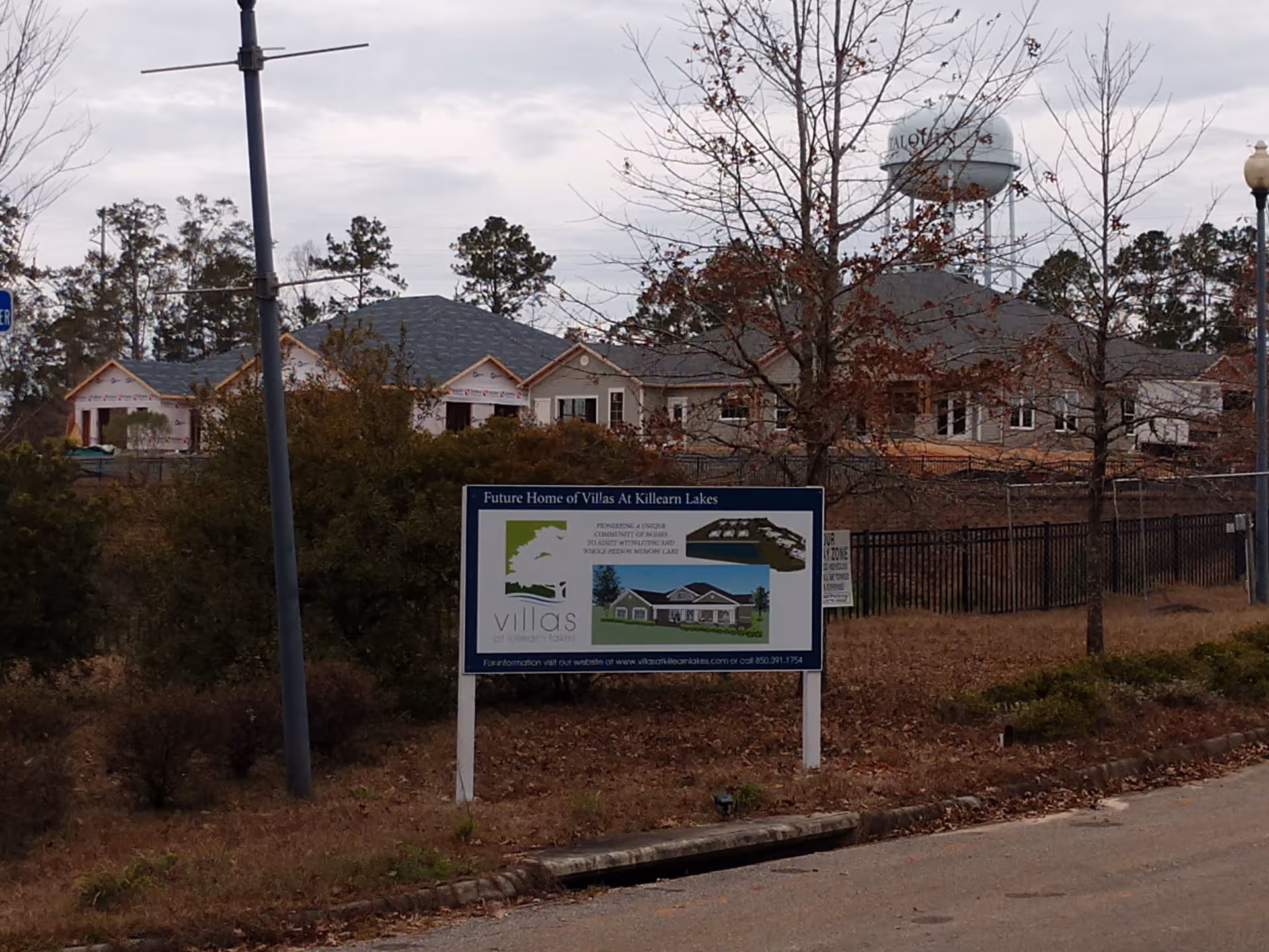 Construction site for Villas at Killearn Lakes with a development sign in foreground