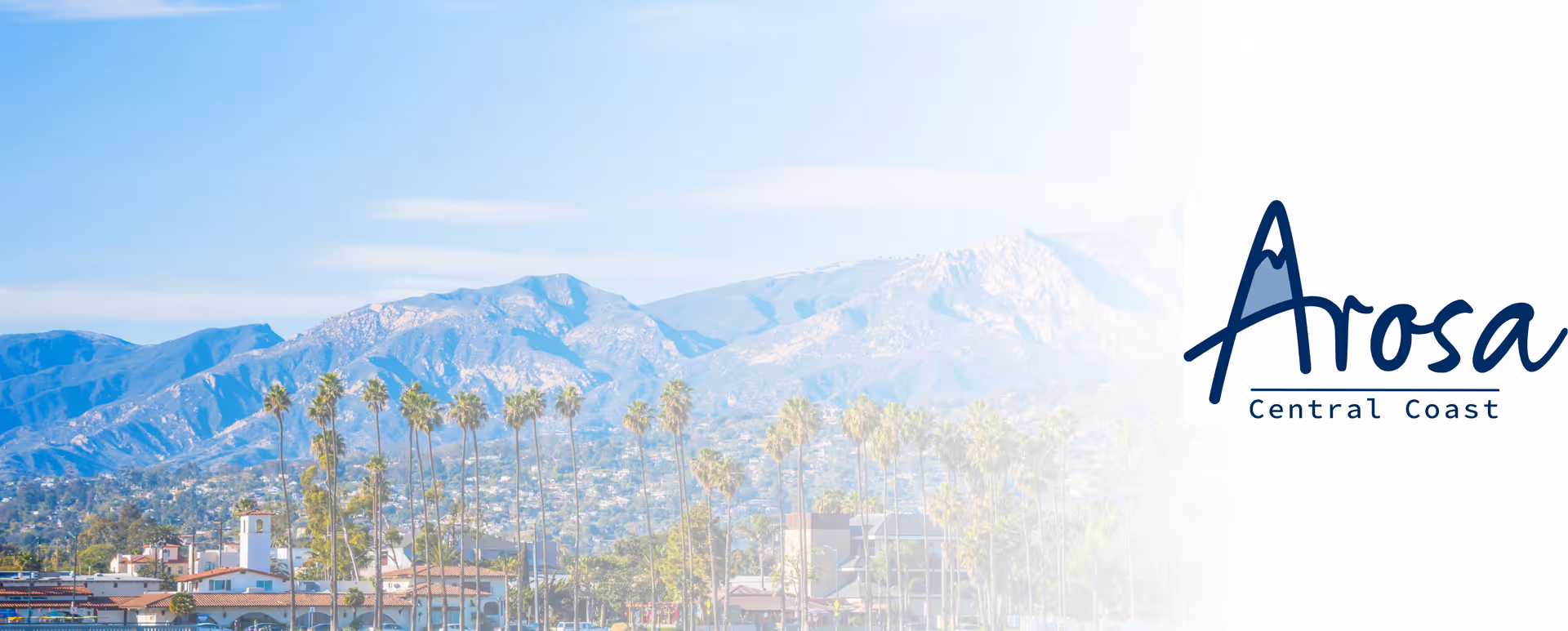Exterior view of Arosa Central Coast SLO with mountains and palm trees.