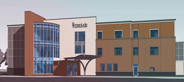 Exterior view of a modern senior living facility labeled Interlude Restorative Suites Unity.