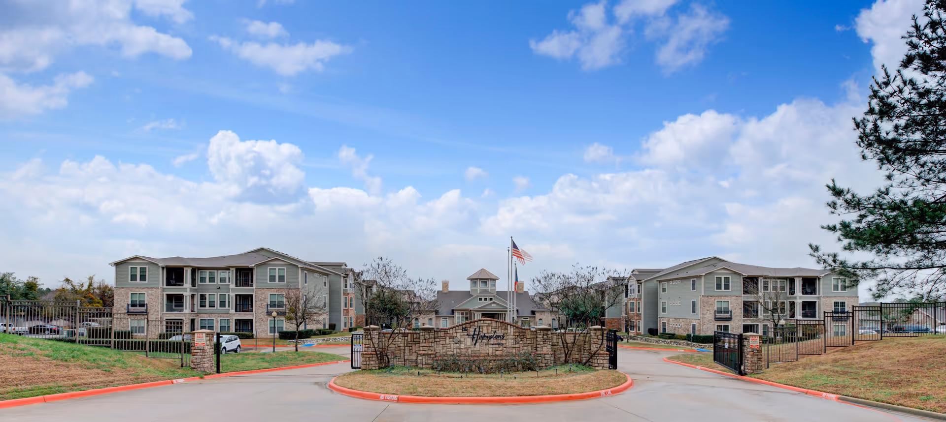 Exterior view of Old Jefferson Community Care Center campus with entrance gate.