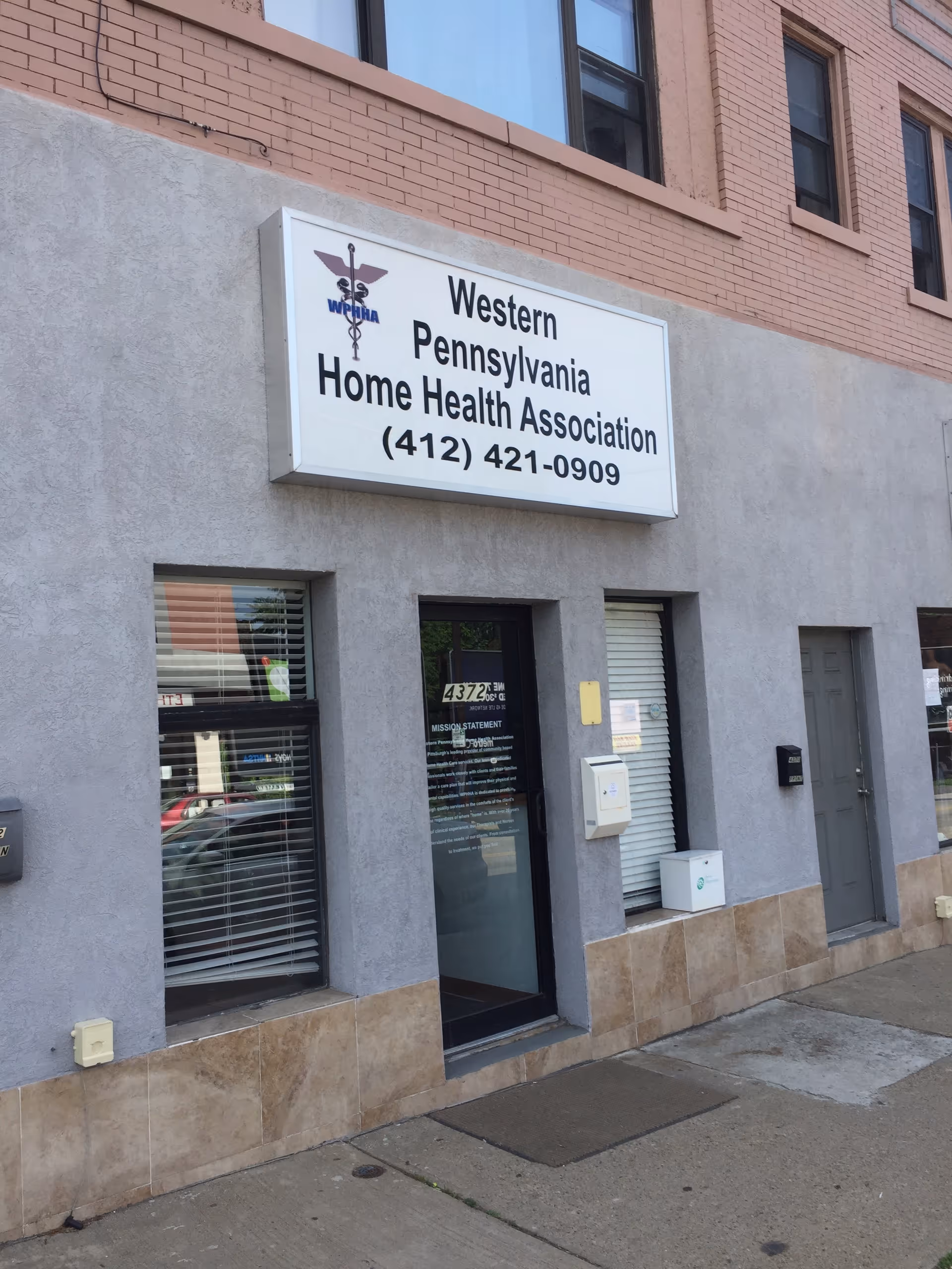 Exterior view of a brick building with a sign for Western Pennsylvania Home Health Association.
