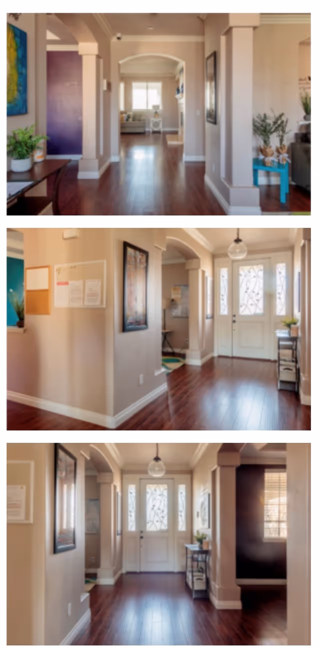 Bright foyer and hallway interior with hardwood floors, decorative front door, columns and seating/decor seen from several angles.