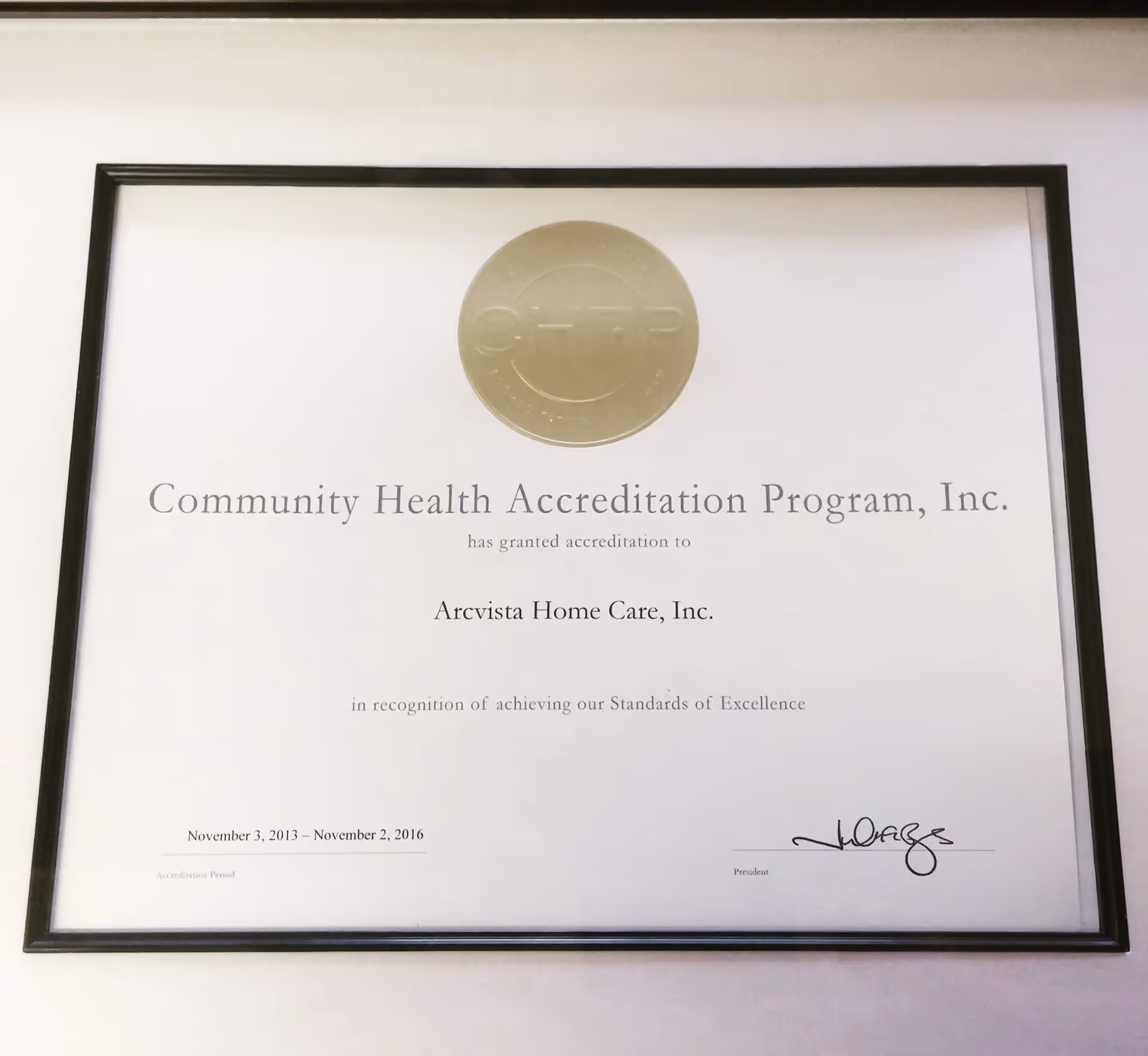 Framed accreditation certificate on a wall for ArcVista Home Care, Inc.