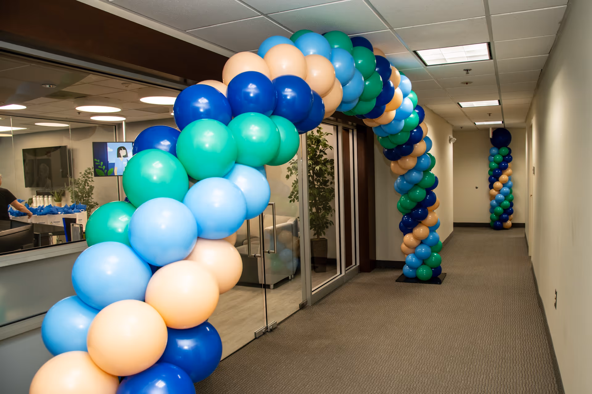 Interior hallway at Advanced Nursing and Home Care with colorful balloon arches.