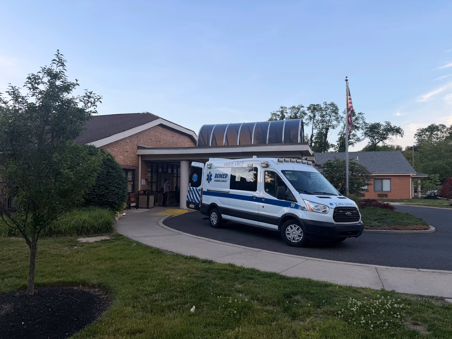 Ambulance parked at the front entrance of Yardley Rehabilitation and Healthcare Center.