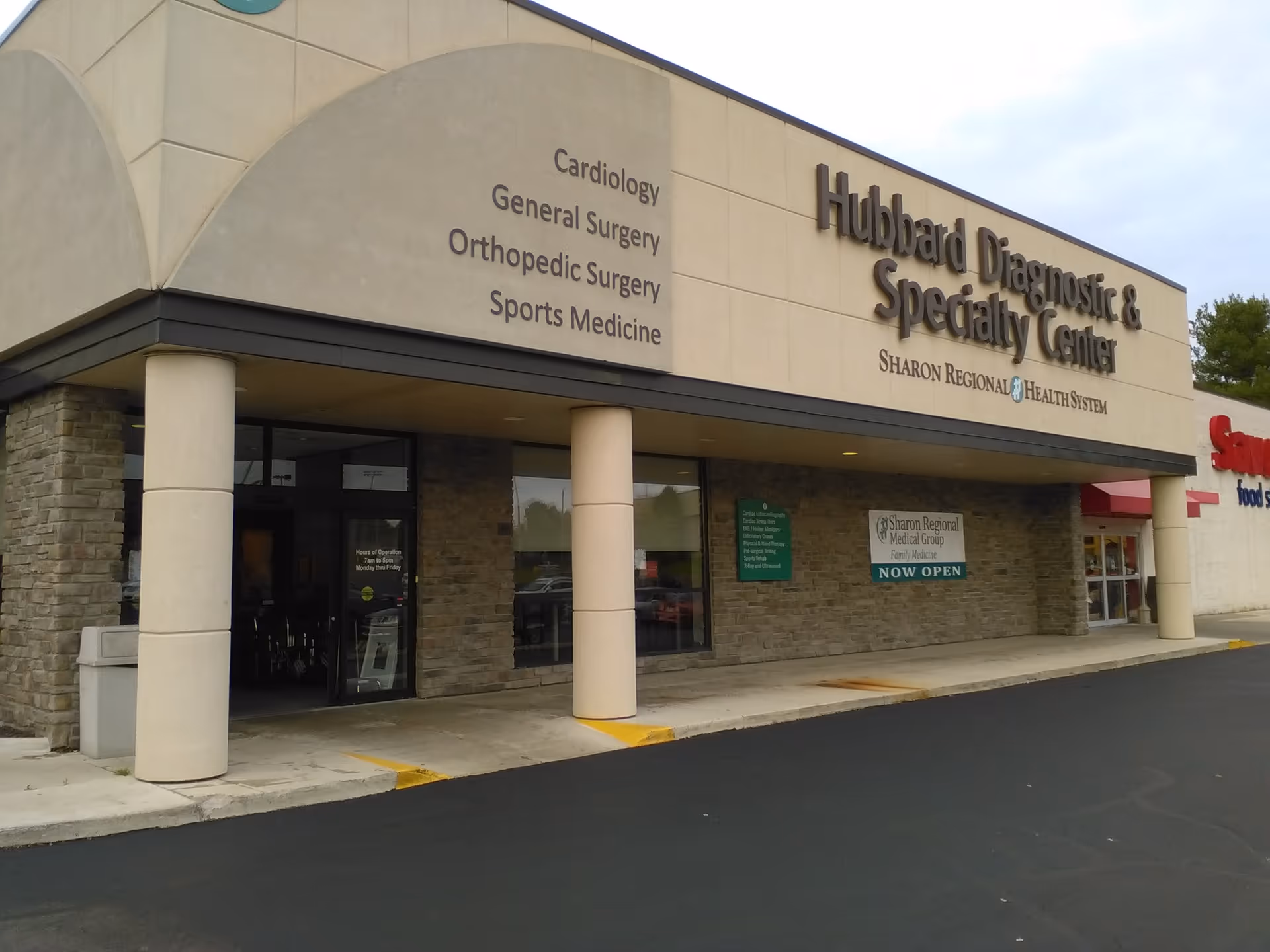 Exterior view of Hubbard Diagnostic & Specialty Center with signs and entry columns.