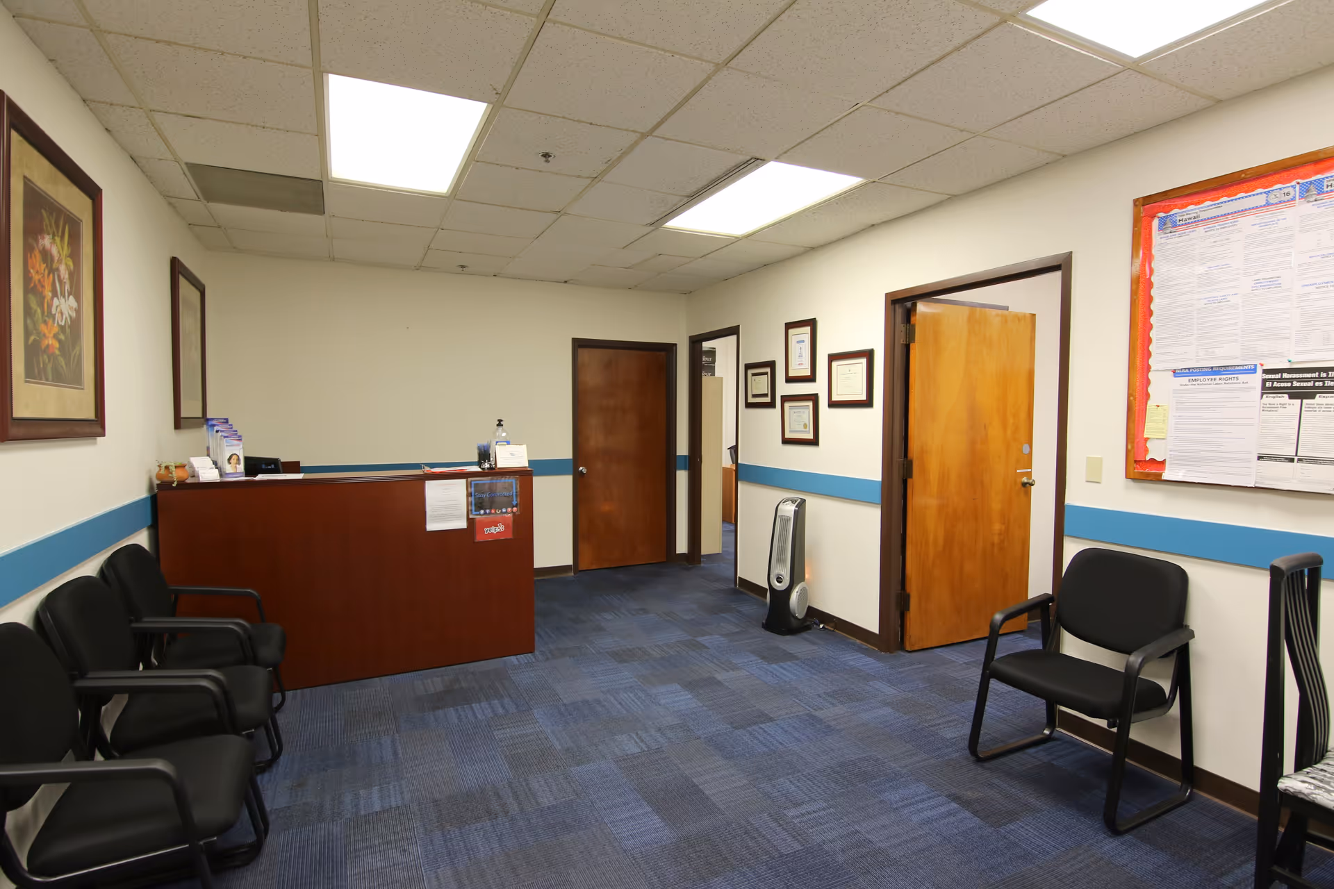 Mastercare of Oahu reception area with desk, chairs, and bulletin board.