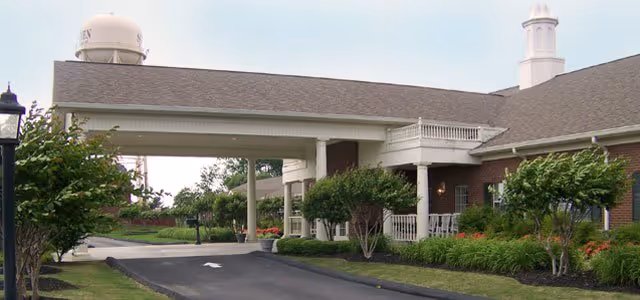 Front entrance of The Pinnacle of Southaven senior living with a covered driveway.