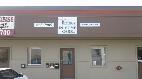Front view of Beneficial In-Home Care, Inc. building with entrance door and signs.