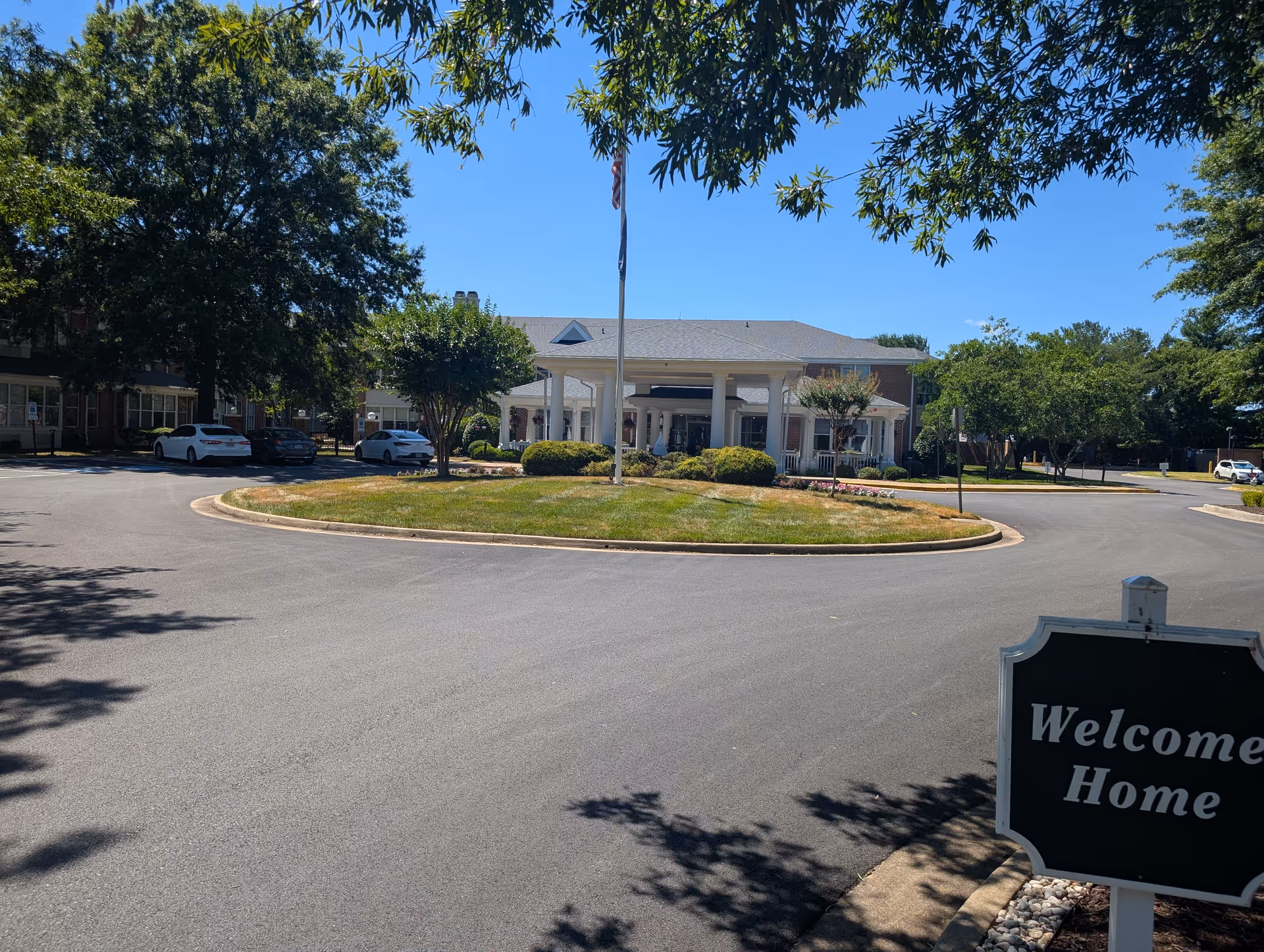 Exterior view of Our Lady of Hope Health Center with circular driveway and entrance canopy.