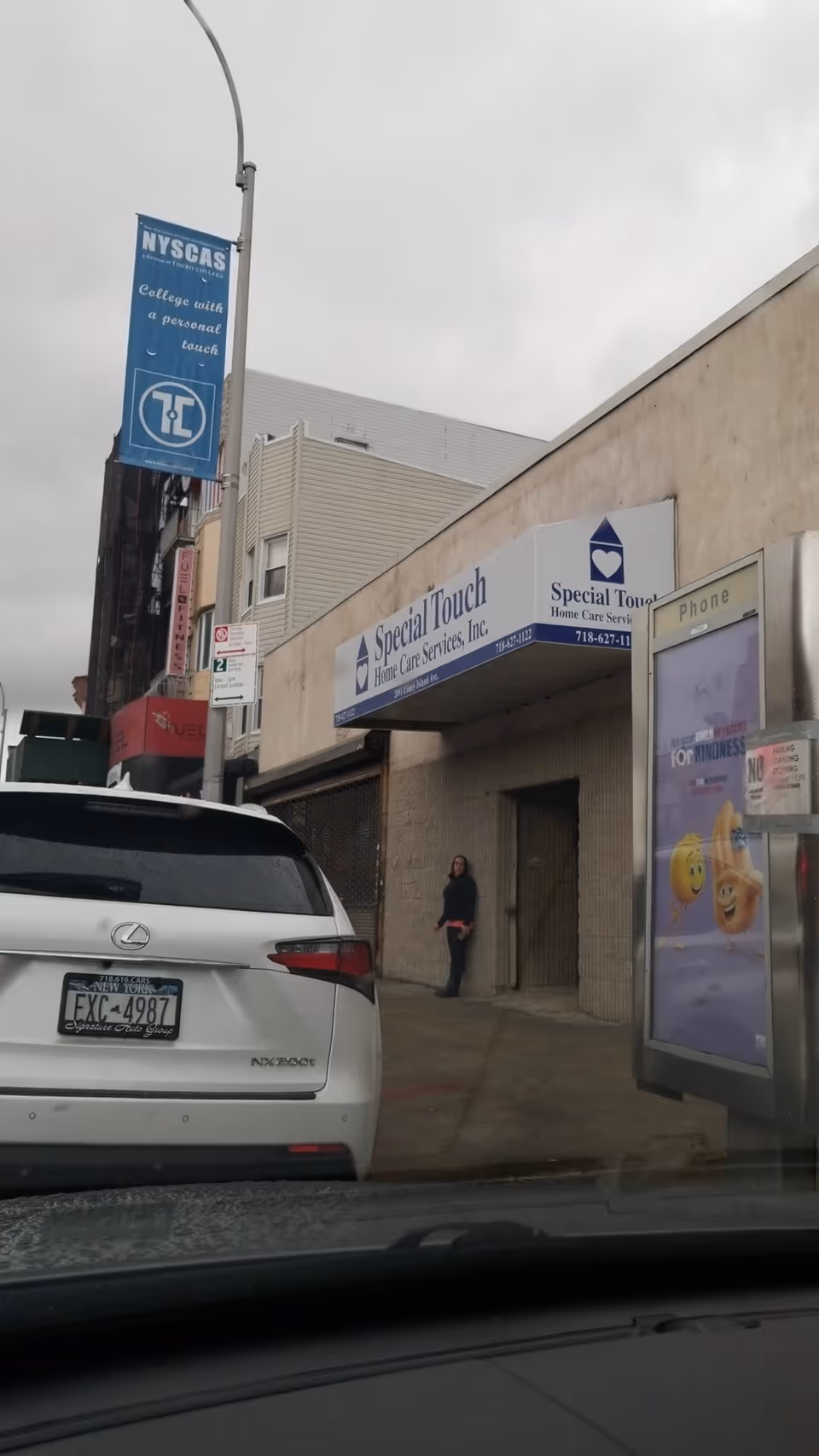 City street exterior shows Special Touch Home Care Services storefront and a parked car.