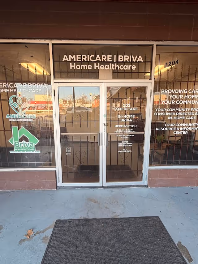 Front entrance of Americare Briva Home Healthcare with glass doors and signage