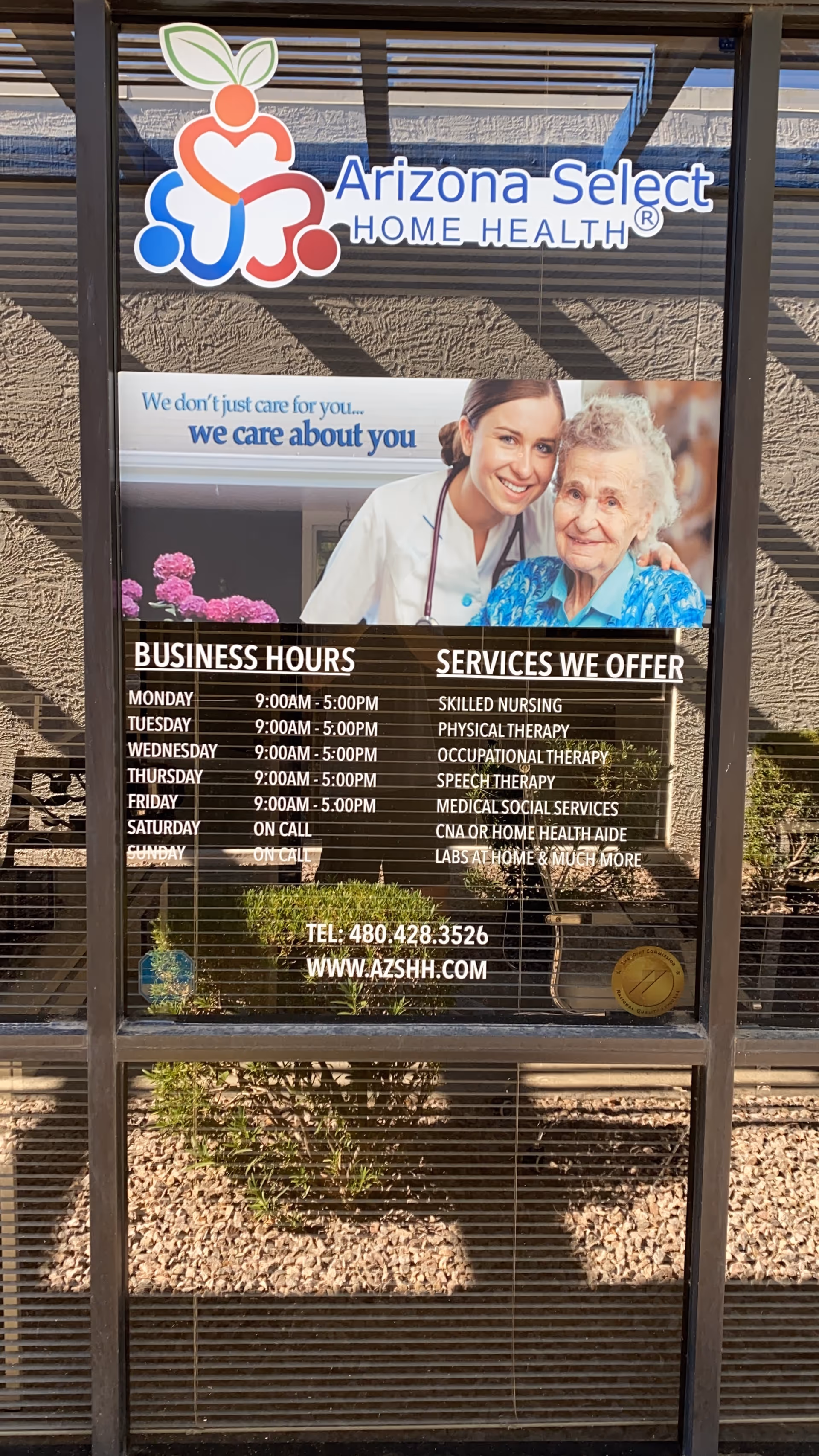 Glass storefront window featuring Arizona Select Home Health logo and service hours sign.