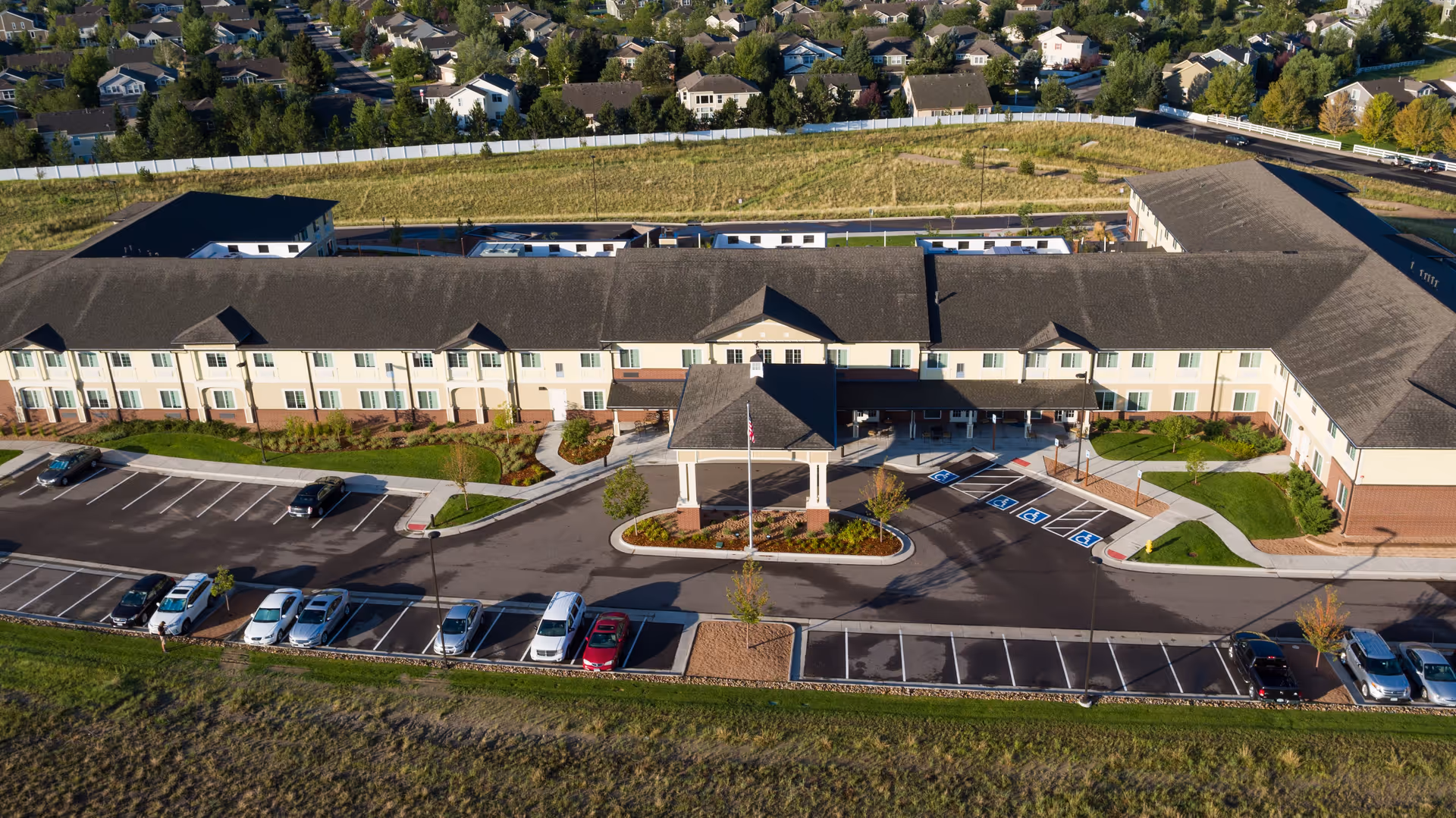 Aerial view of Peakview Assisted Living and Memory Care building with parking and entrance.