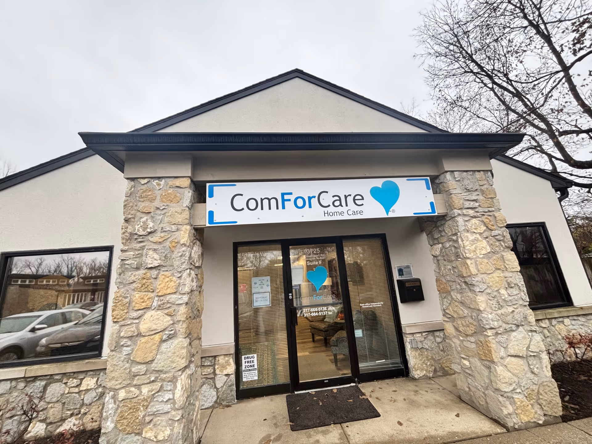 Exterior view of ComForCare Home Care building with stone pillars and entrance.