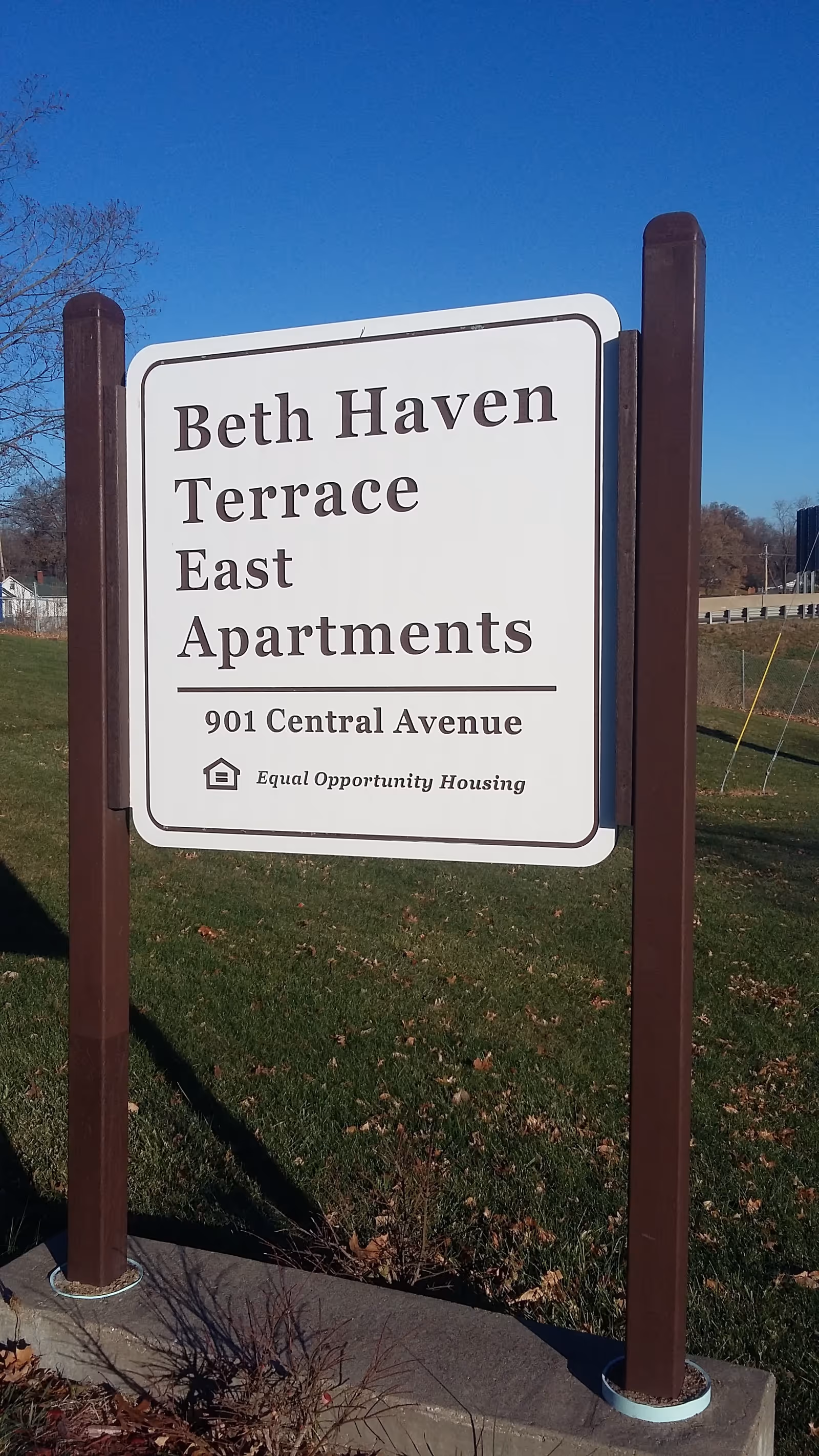 Sign reading Beth Haven Terrace East Apartments outdoors on a grassy area