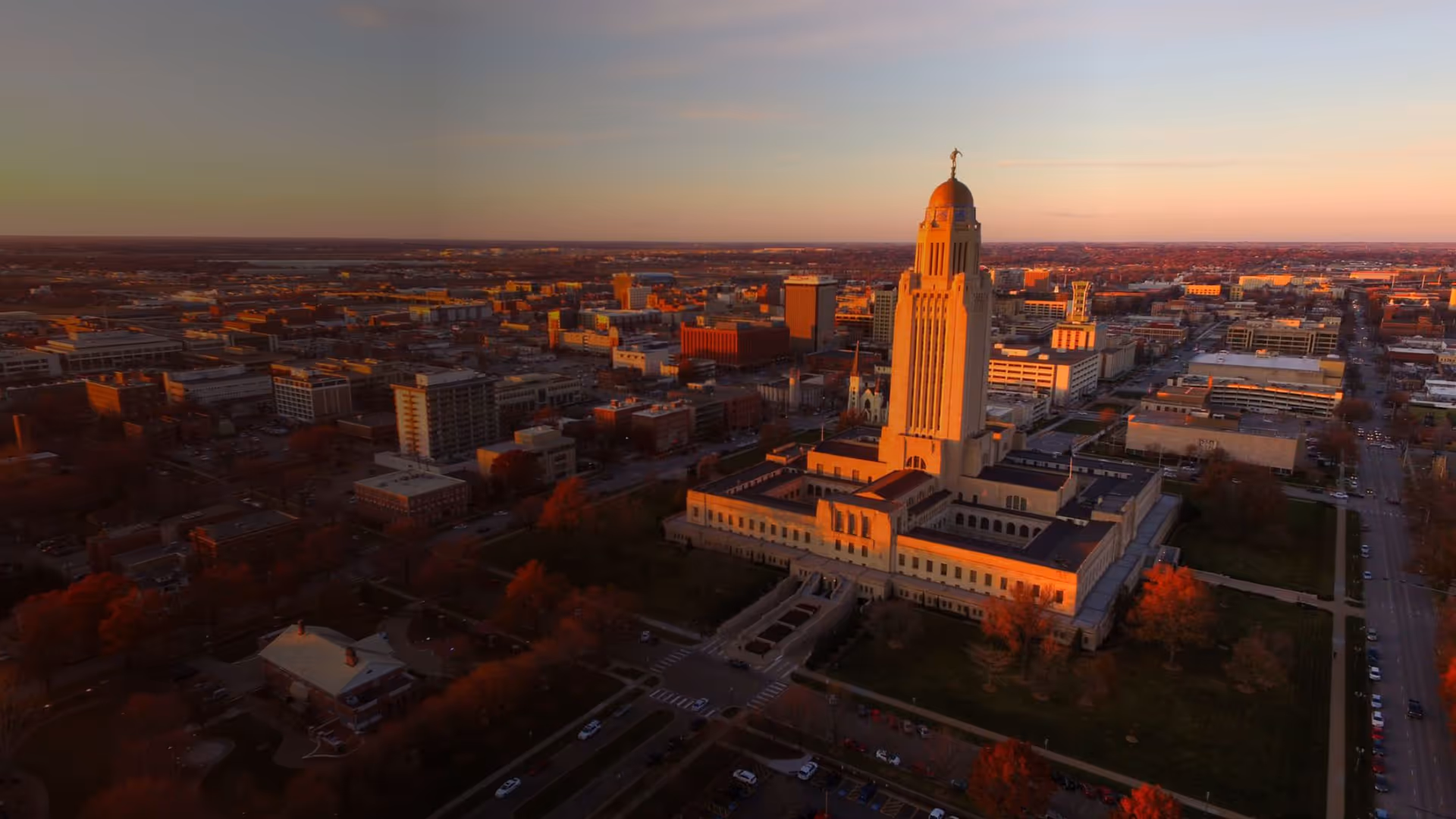 Aerial view of Lincoln with a domed capitol building and city streets