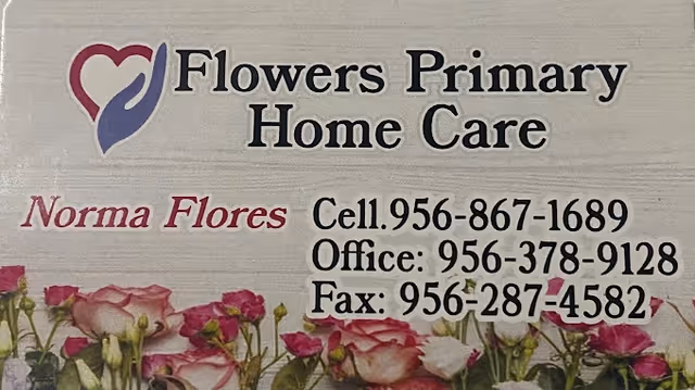 Exterior sign for Flowers Primary Home Care featuring a heart logo and flowers