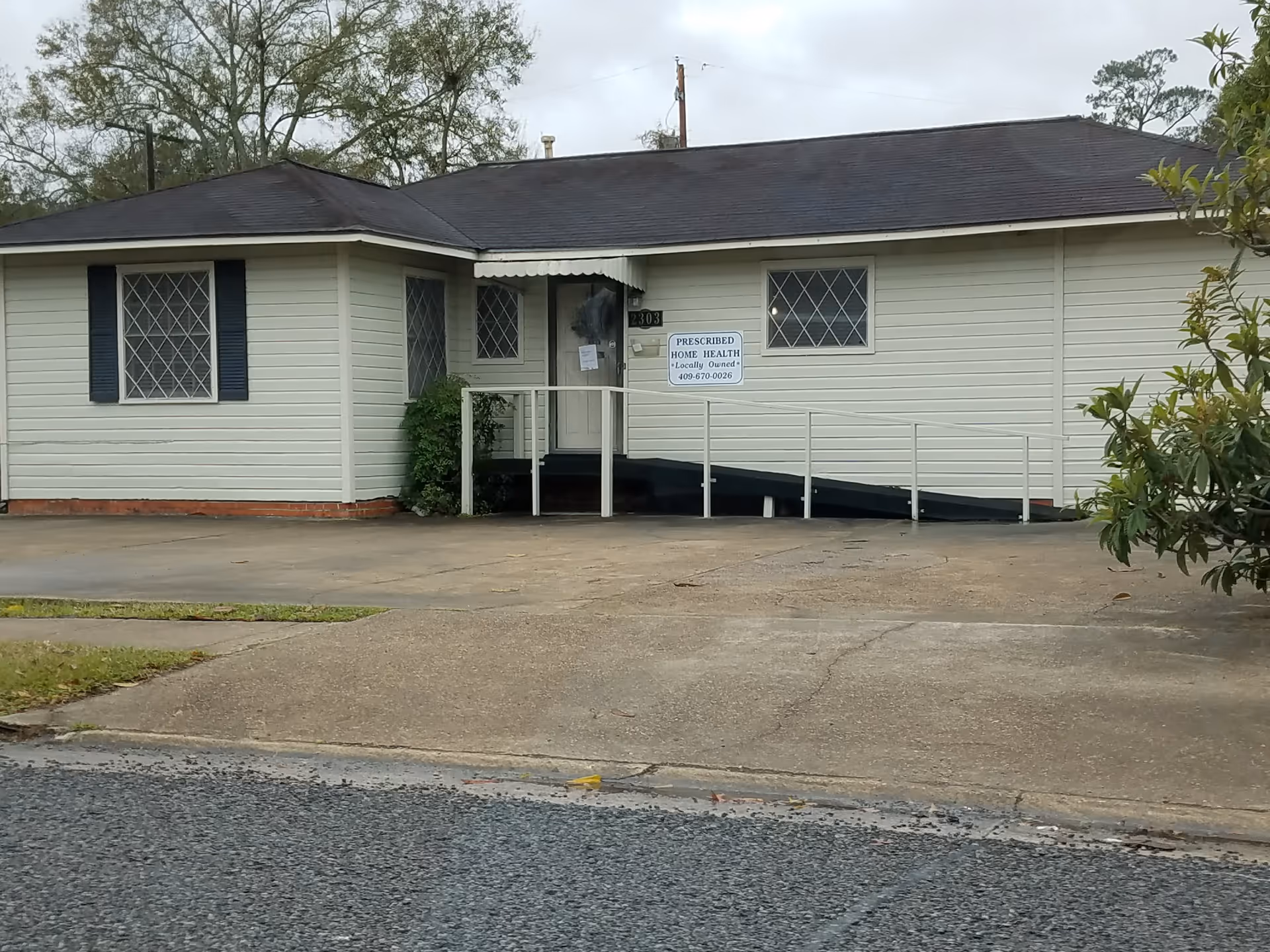 White single-story building with ramped entrance and a Prescribed Home Health sign.