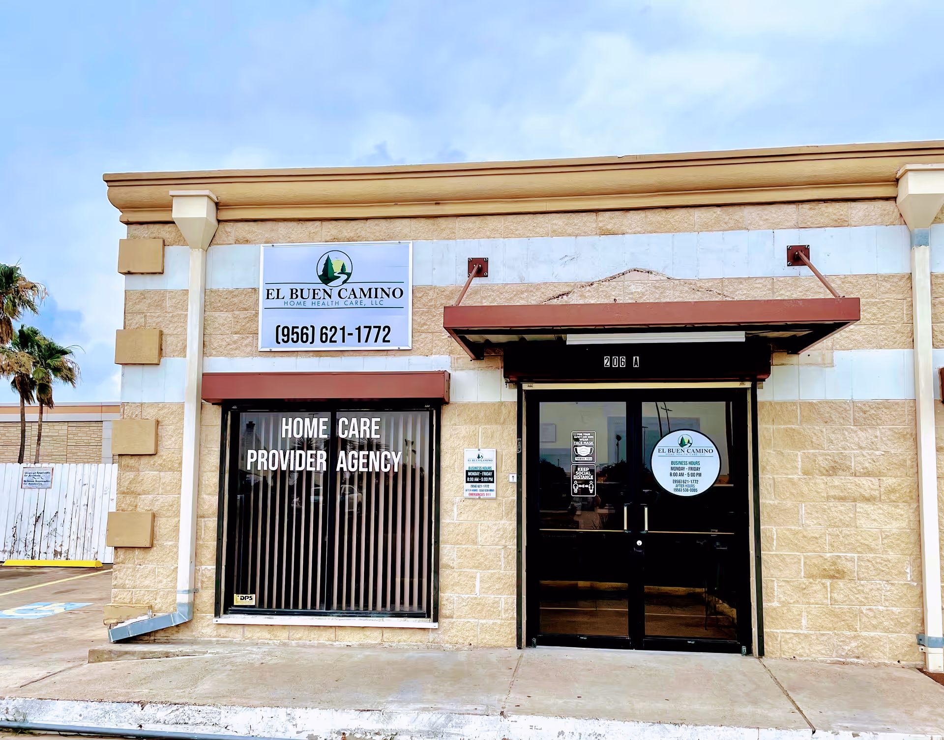 Exterior view of a beige brick building with El Buen Camino Home Health Care sign.
