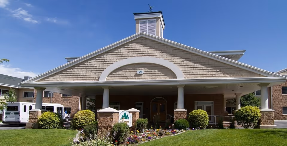 Front view of Legacy House of Bountiful with entrance, columns, and manicured landscaping
