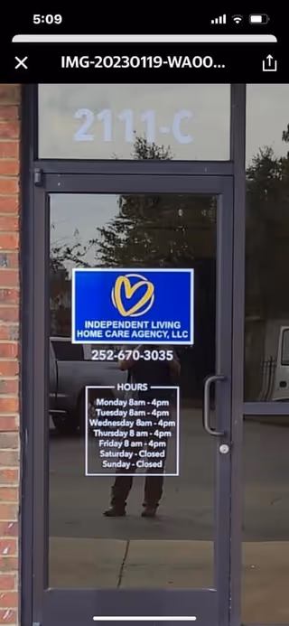 Glass door entrance with a sign for Independent Living Home Care Agency, LLC.