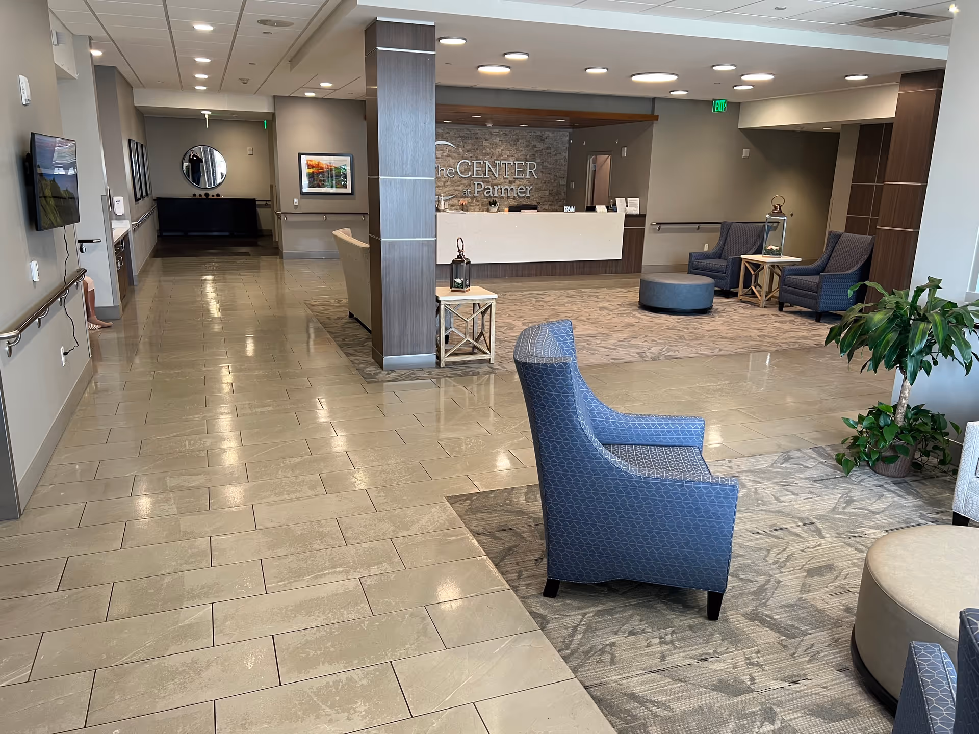 Lobby reception area of The Center at Parmer with seating and a front desk.