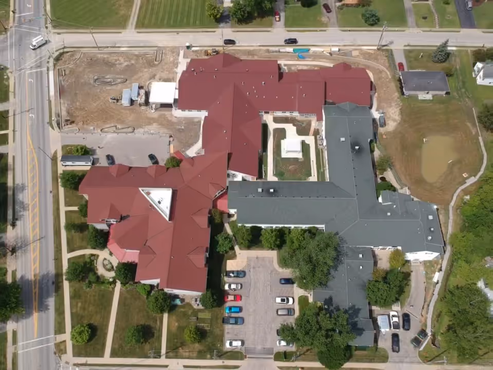 Aerial view of Briar Hill Health Care Residence with parking and surrounding grounds.
