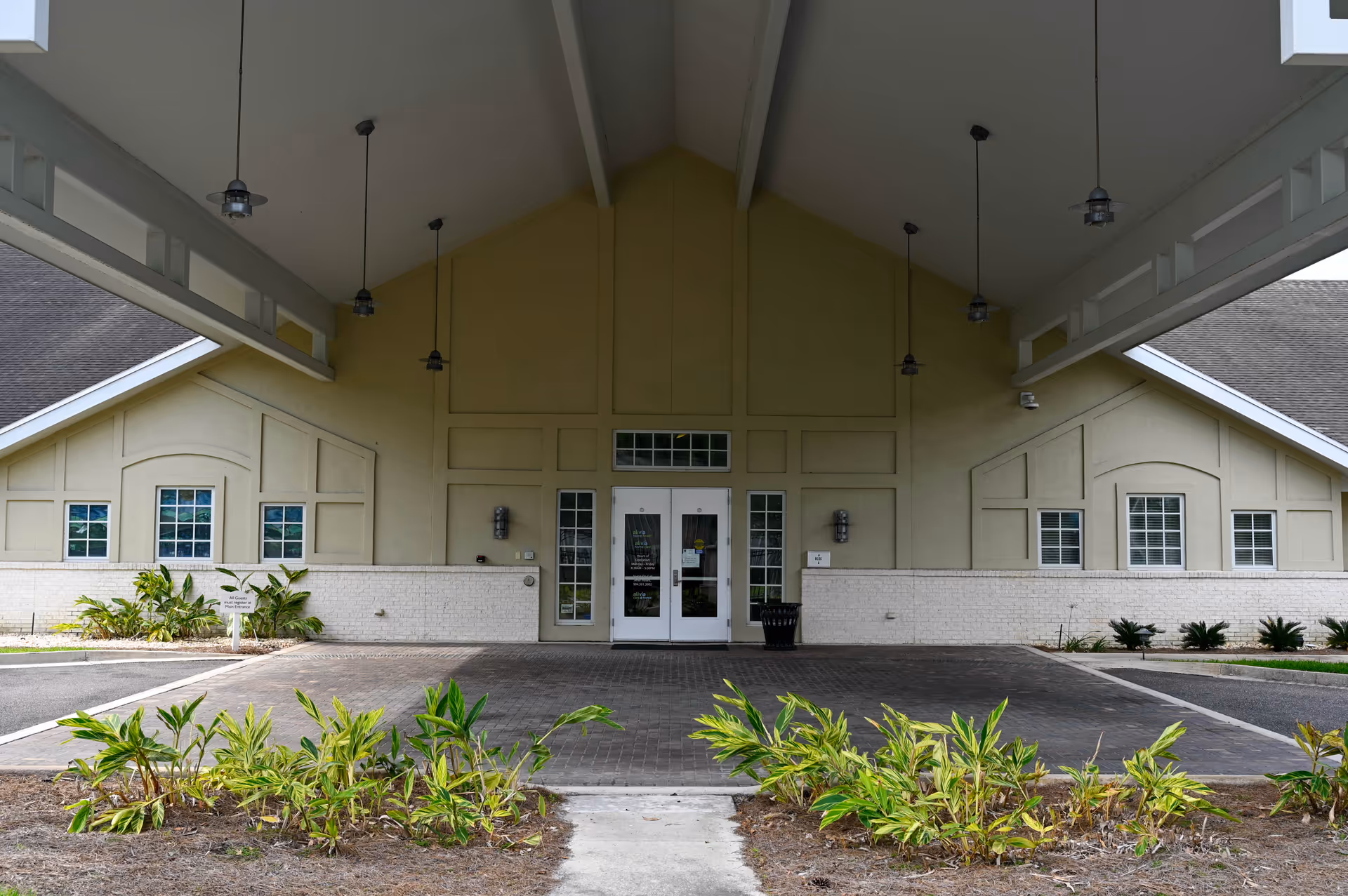 Front exterior entrance of Alivia Care @ Home under a large covered porte-cochere.