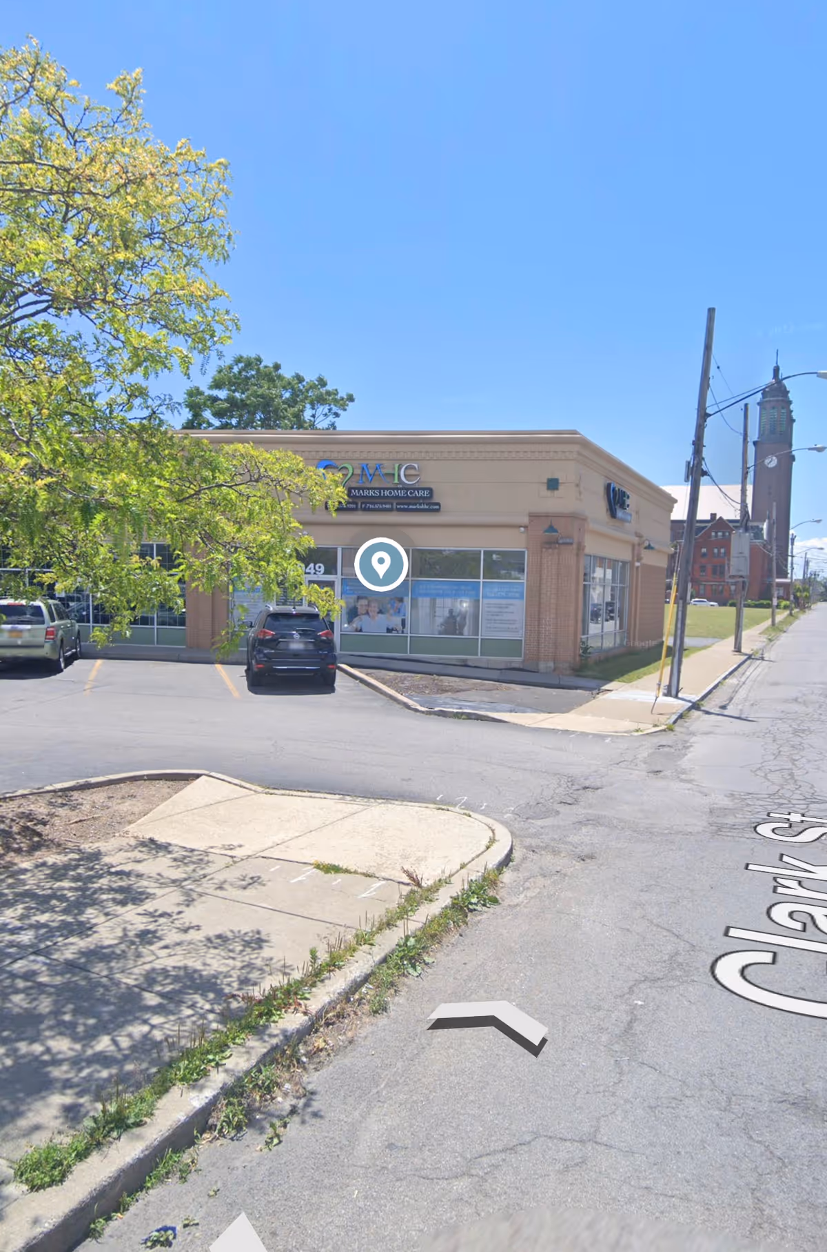 Exterior view of Marks Home Care Agency building with parking lot and street.